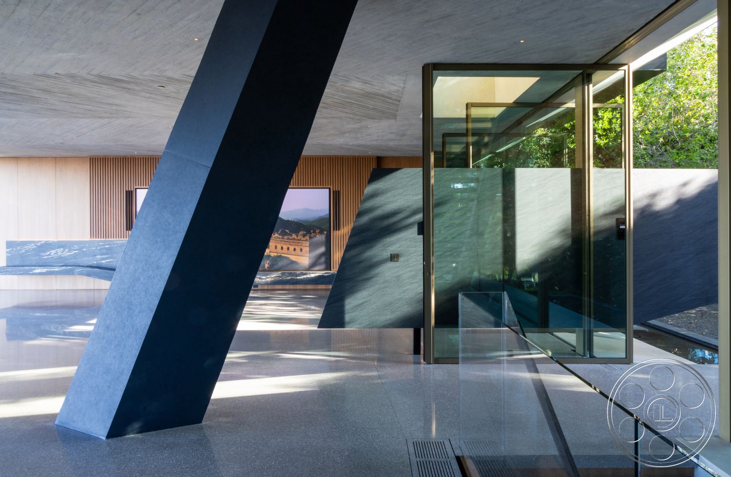 Modern 516 - polished concrete flooring, floor-to-ceiling windows, contemporary architectural style, textured stone accent wall, glass sliding door entry, exposed concrete structural column, concrete ceiling with wood paneling, wood paneled feature wall