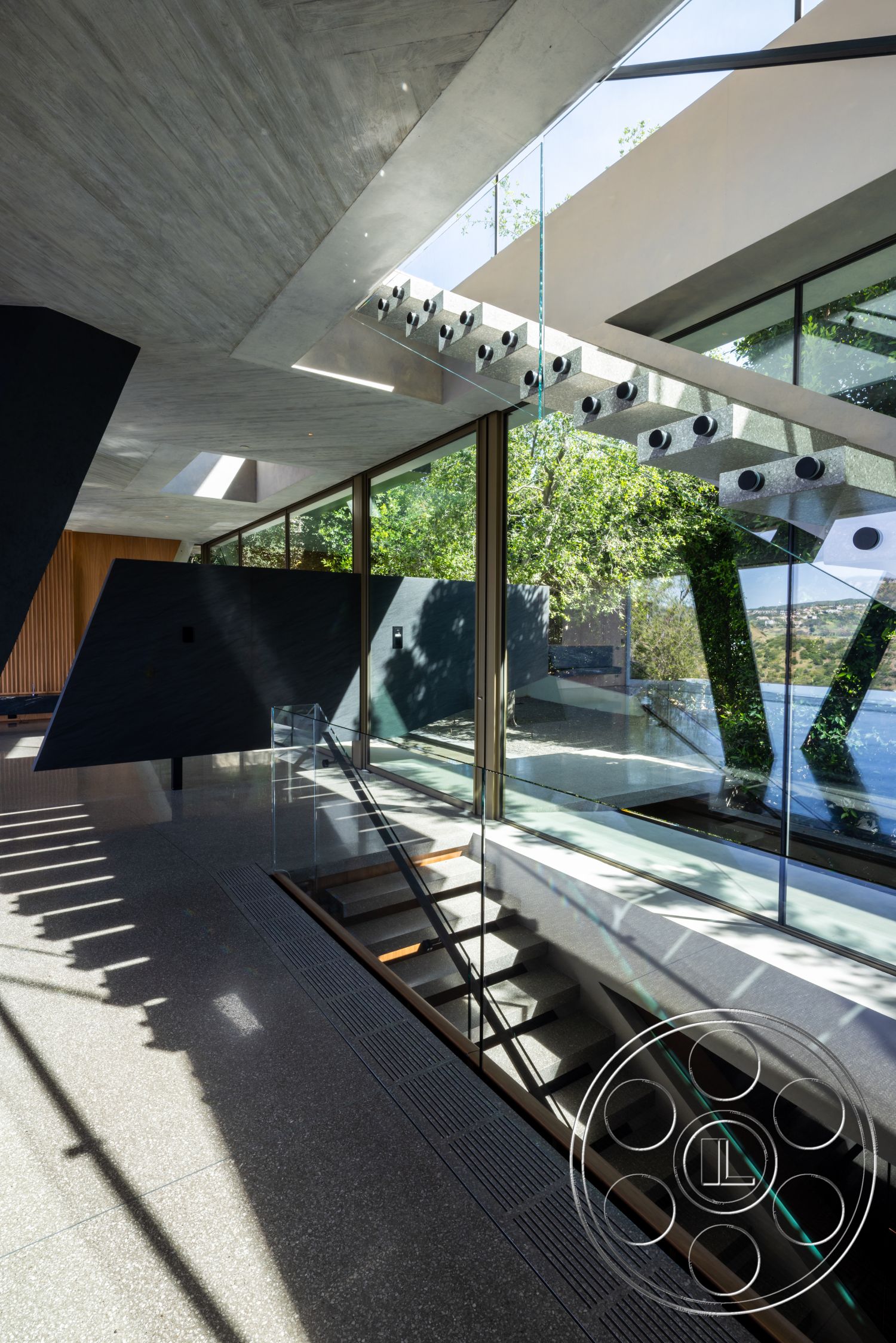 Modern 516 - natural light, exterior, minimalist design, terrazzo flooring, landscape view, exposed concrete walls, vaulted ceiling, geometric shapes, modern architectural style, concrete ceiling, glass stair railing, glass floor-to-ceiling windows, open concept interior, wood staircase treads