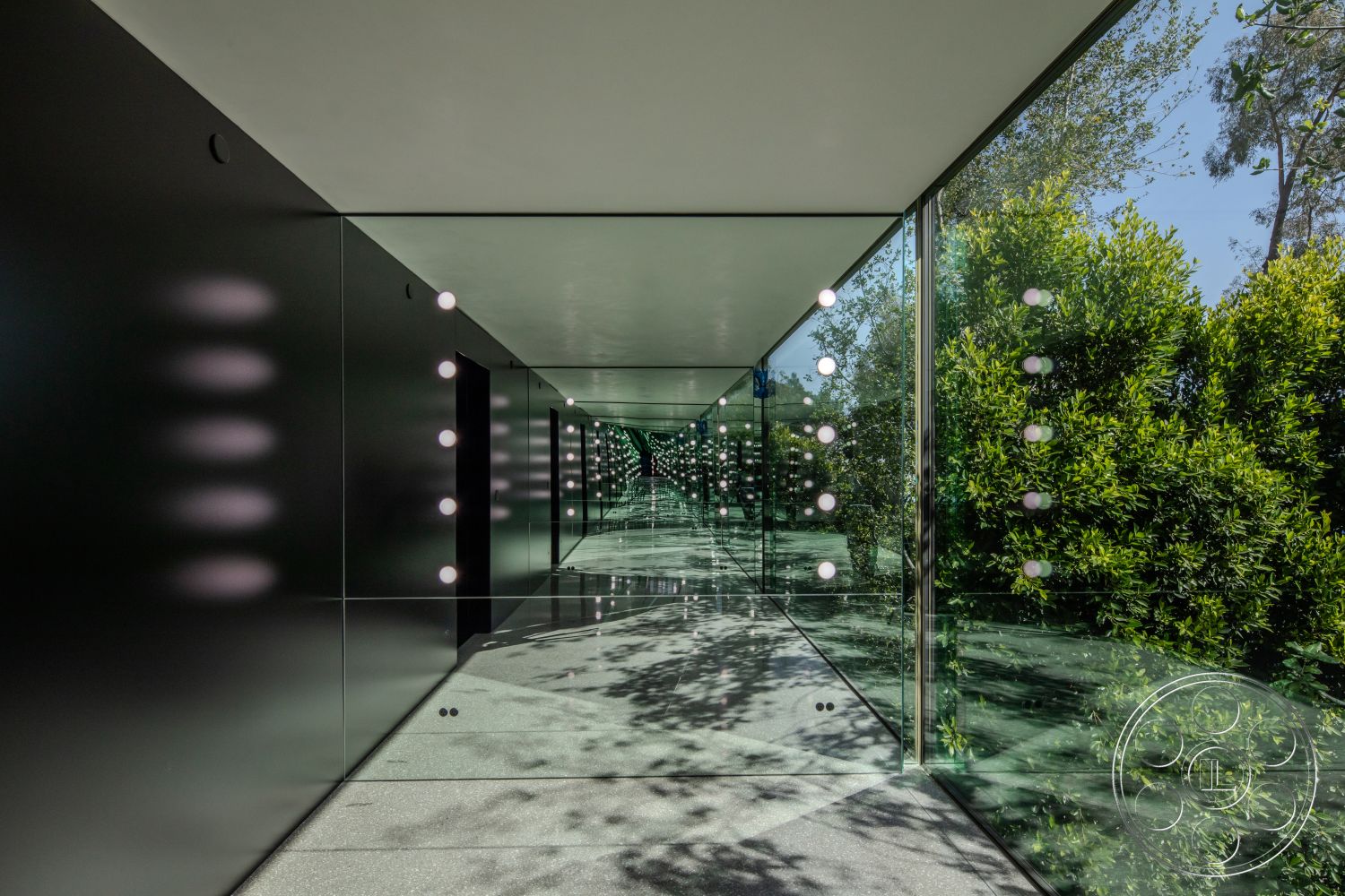 Modern 516 - polished concrete floor, modern lighting fixtures, minimalist design elements, floor-to-ceiling windows, contemporary architectural style, landscaped green surroundings, mirrored wall panels, exterior glass corridor, framed glass walls