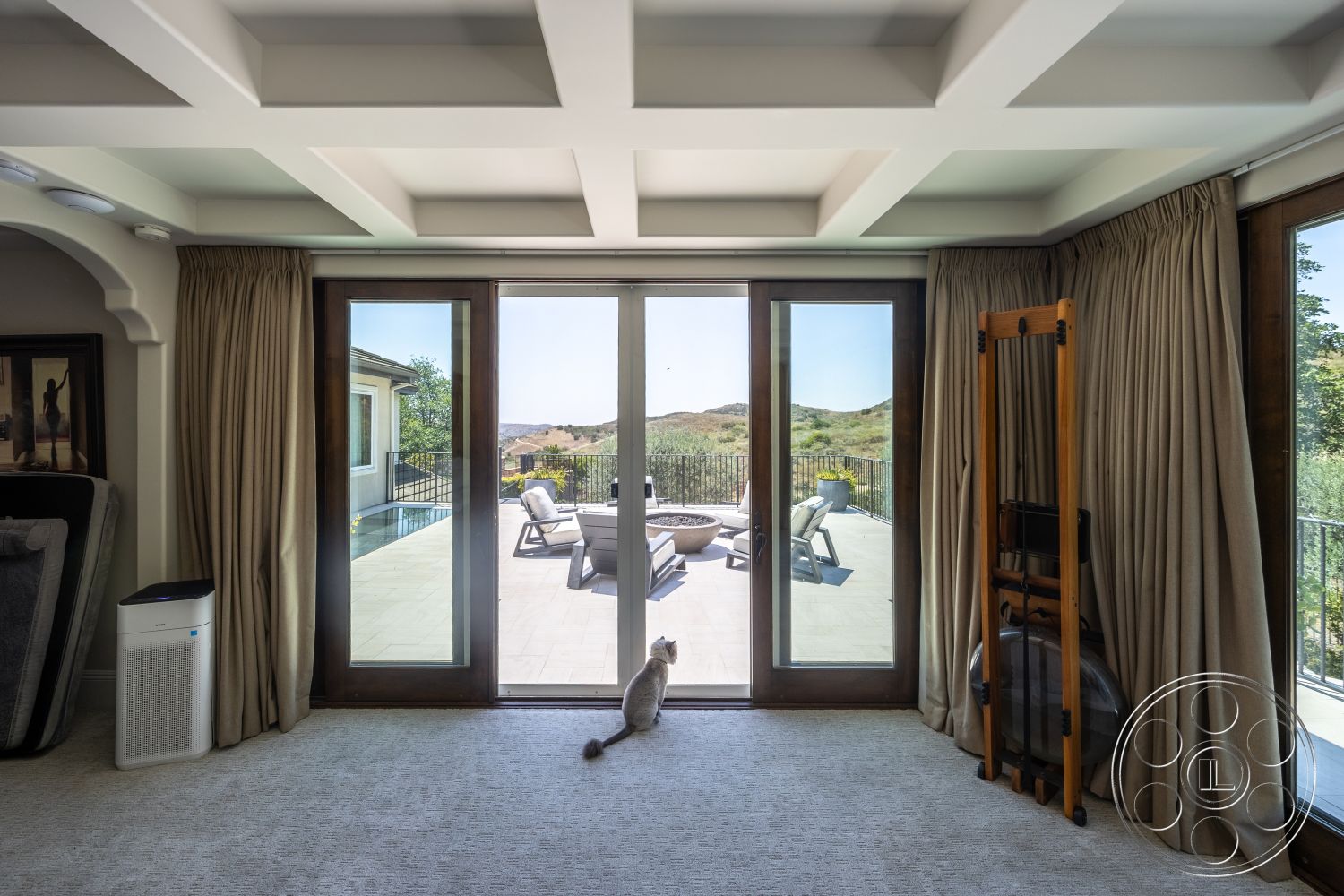 Hayden House - neutral color palette, mountain view, modern lounge area, textured carpet flooring, open concept living area, coffered ceiling details, floor-to-ceiling glass doors, warm wood window frames, light beige drapery