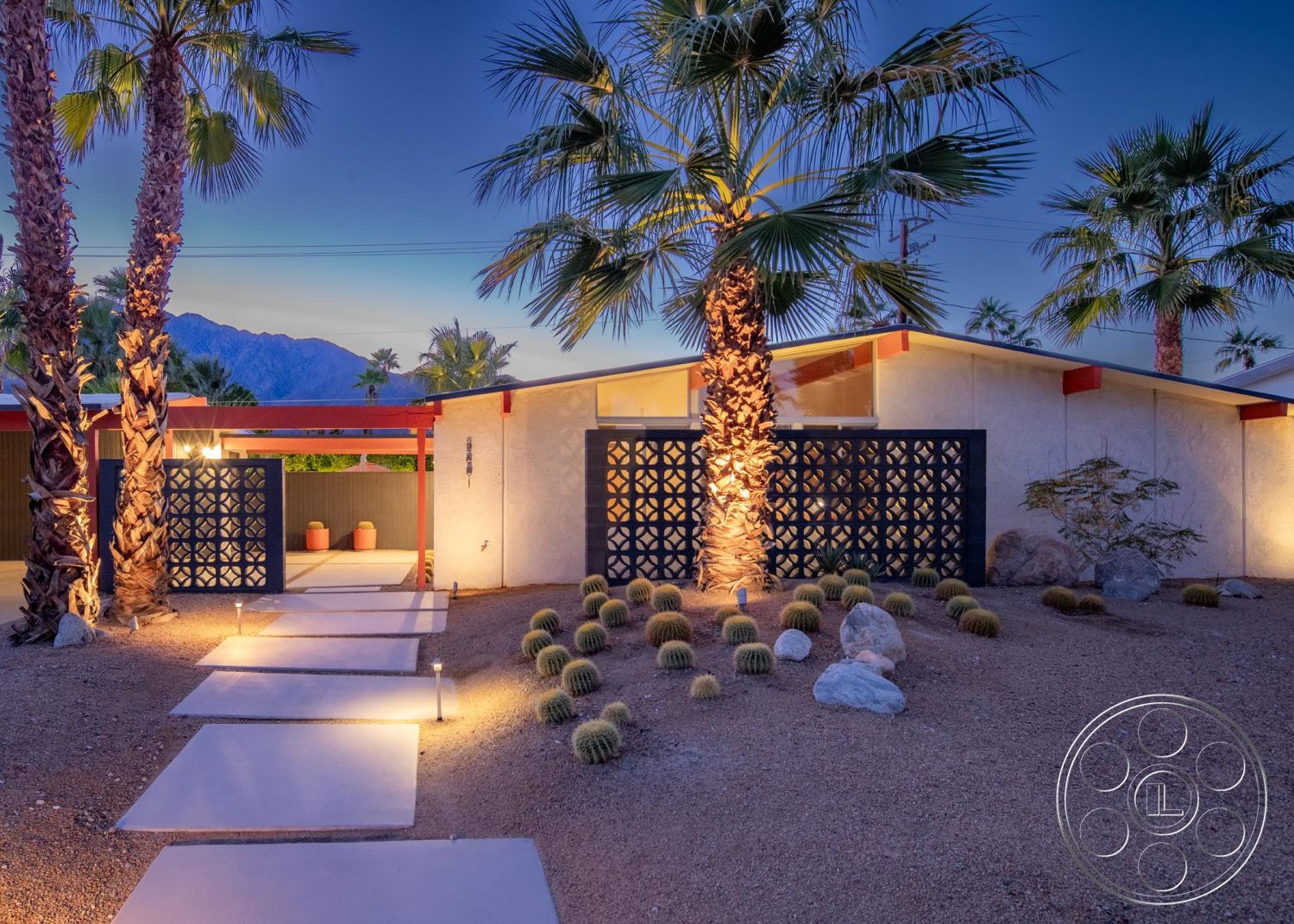 Palm Springs 76 - exterior, flat roof, palm trees, concrete pathway, modern architectural style, mountain view, desert landscaping, stucco walls, outdoor lighting fixtures, landscaped garden with rocks, red wood accent beams, decorative concrete block fence