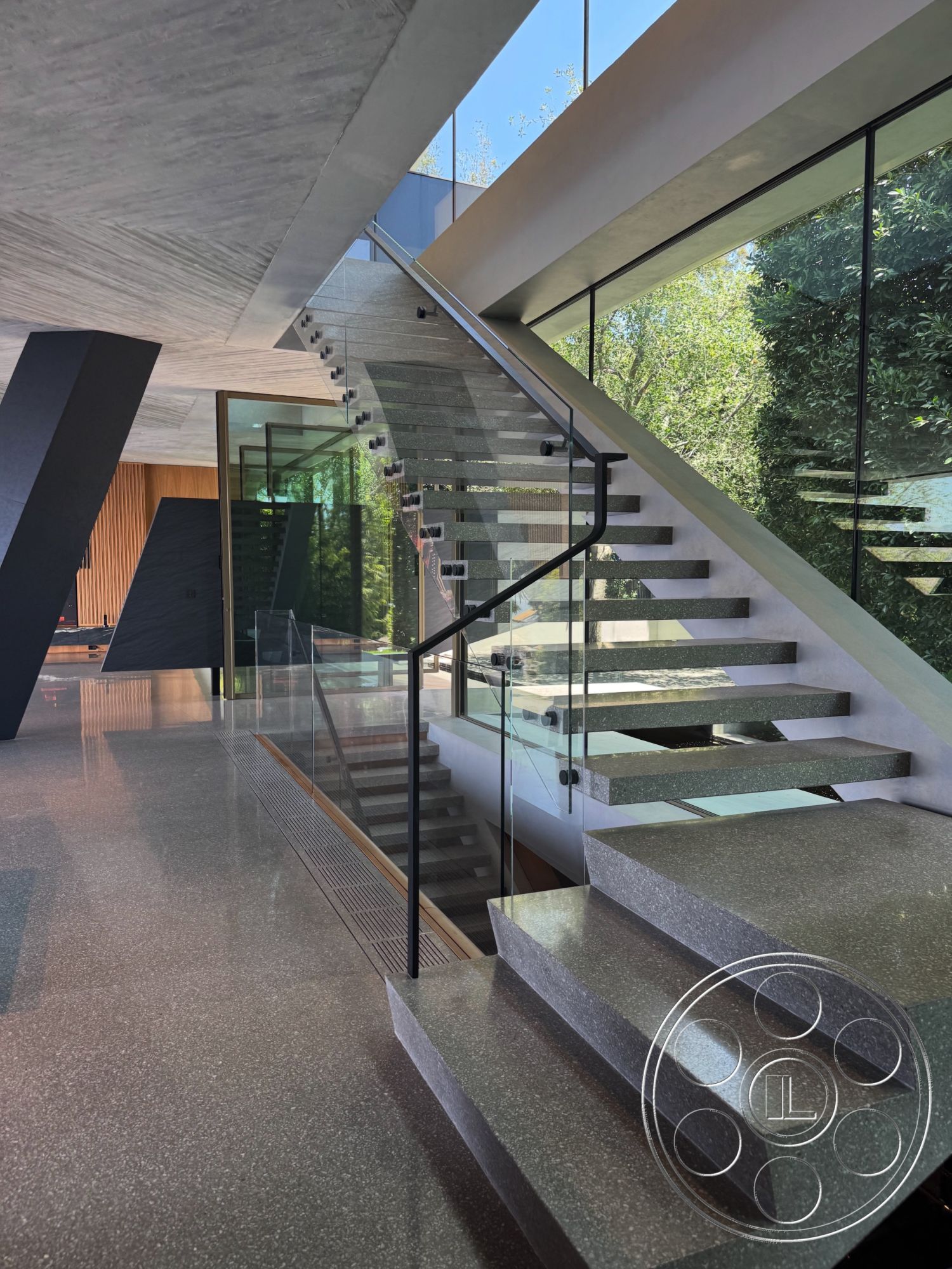 Modern 516 - natural light, minimalist design, terrazzo flooring, sliding glass doors, concrete wall, modern architectural style, indoor greenery, large floor-to-ceiling windows, floating staircase, exposed wood ceiling beams, open-concept space, steel structural elements, glass staircase railings