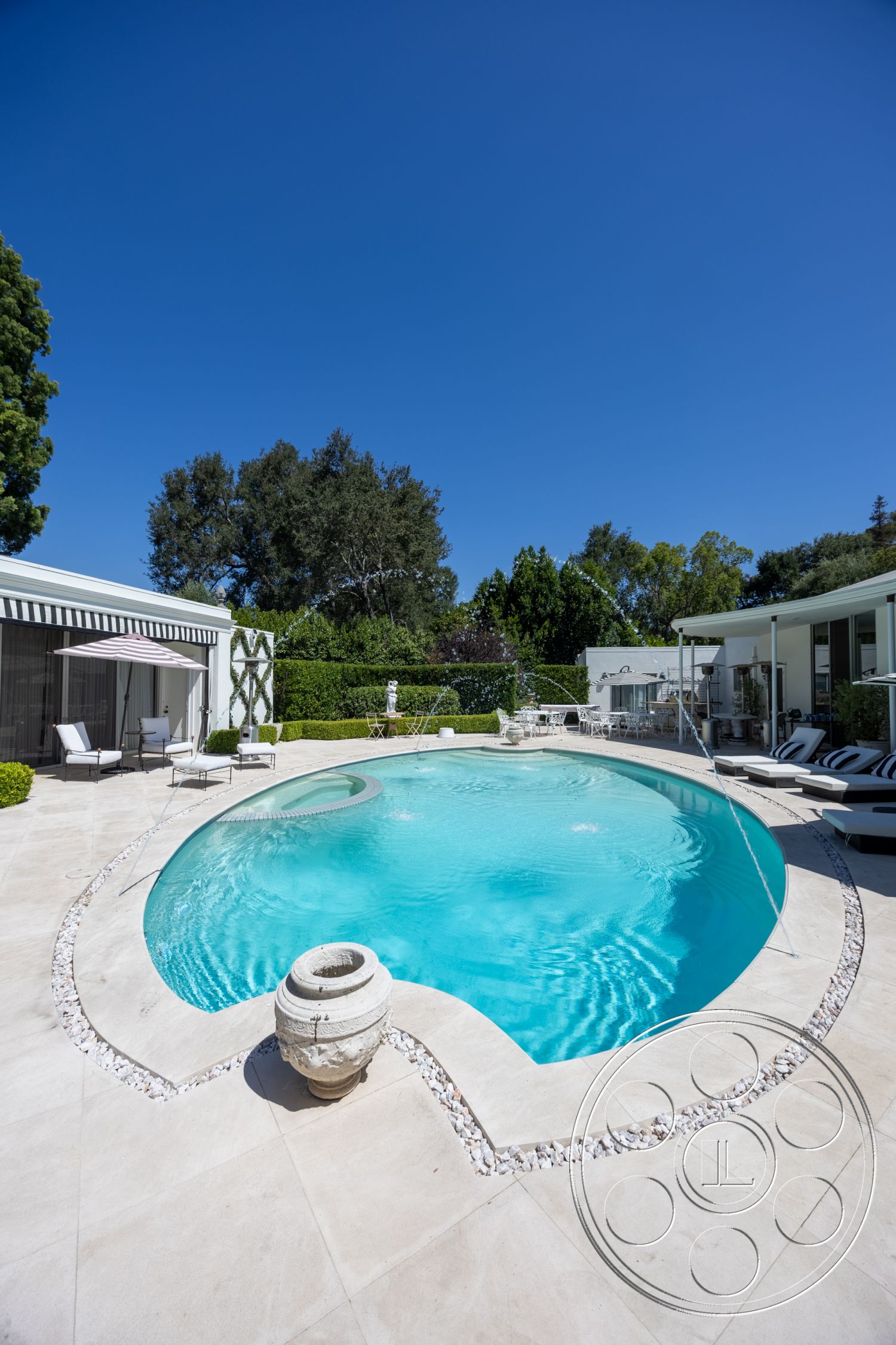 Retro 295 - exterior, modern outdoor furniture, floor-to-ceiling windows, outdoor lounge area, stone pool deck, oval swimming pool, landscaped garden setting, concrete pool border, tan tile patio flooring