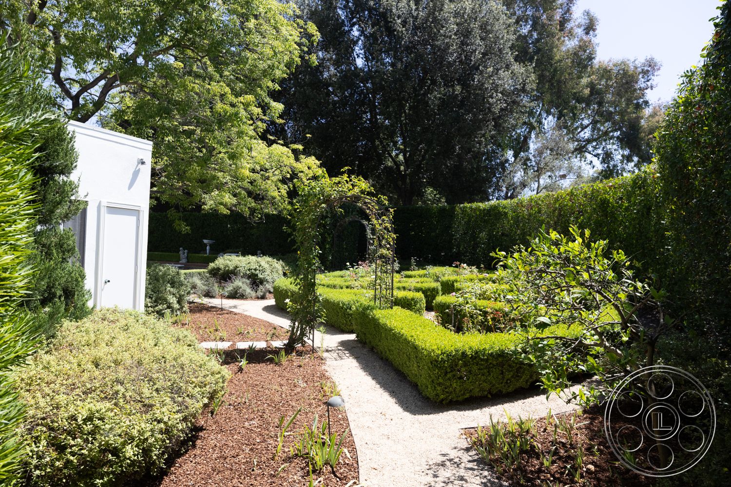 Retro 295 - exterior, lush green foliage, flowering shrub borders, gravel garden flooring, sunlit garden setting, wooden garden trellis, cobblestone garden paths, neatly trimmed boxwood hedges, decorative garden archway, ornamental garden fountain, urban garden layout
