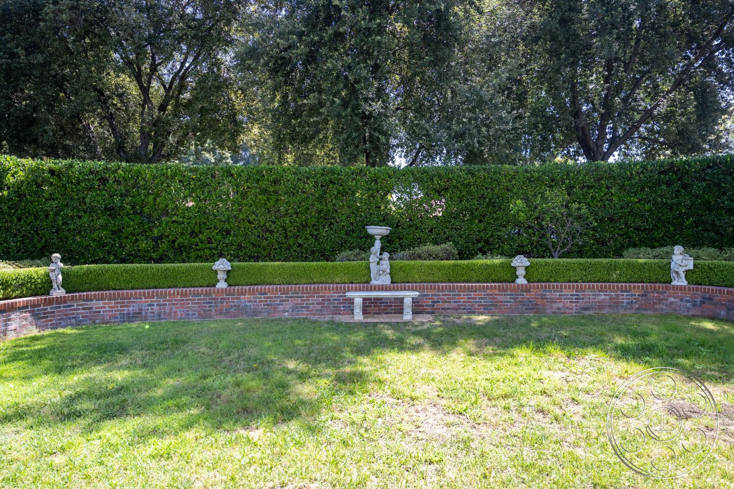 Retro 295 - lawn area, brick garden wall, exterior garden setting, curved garden bench, landscaped outdoor space, stone garden sculptures, manicured hedge border