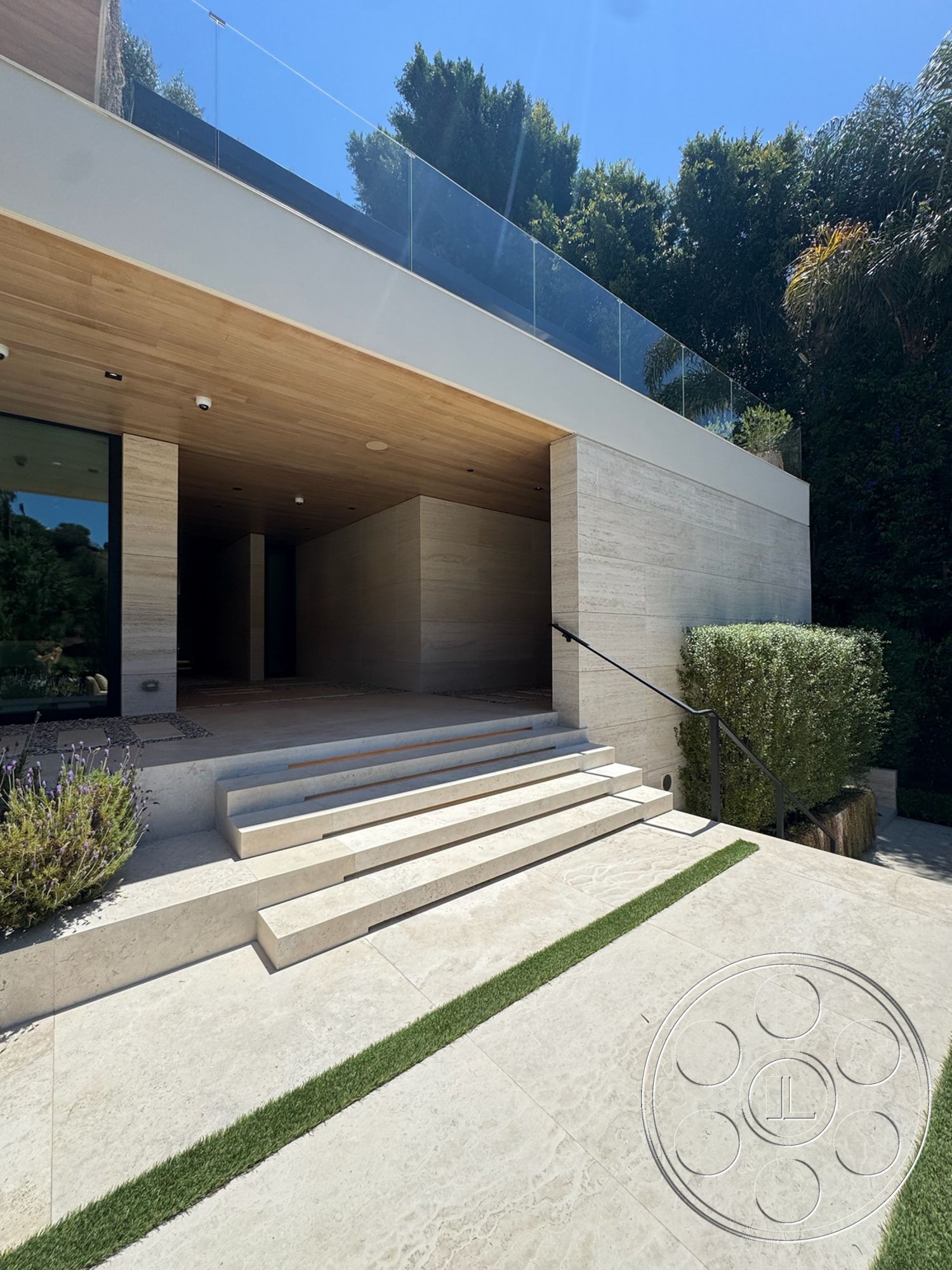 Chalon Estate - glass railing, outdoor landscaping, modern entrance, contemporary architectural style, limestone patio flooring, wood ceiling paneling, limestone steps, artificial grass strips