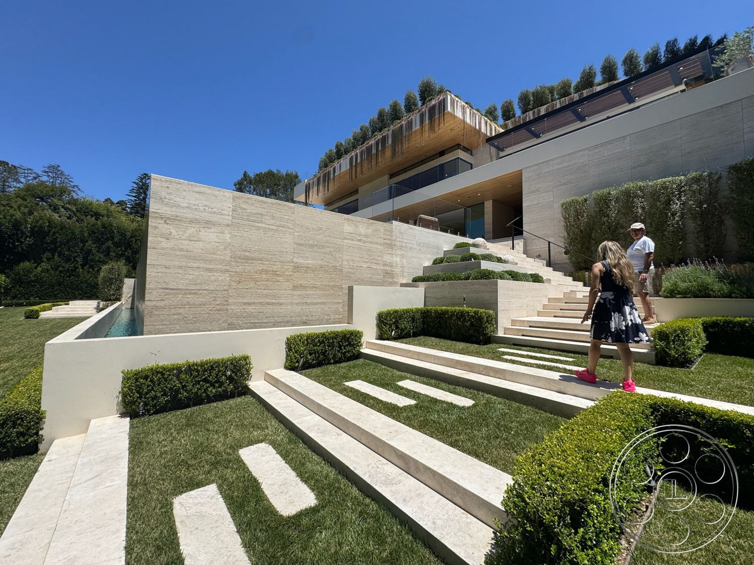 Chalon Estate - exterior, rectangular swimming pool, grass lawn, outdoor living space, minimalist landscape, modern architectural style, landscaped hedges, concrete retaining wall, stone garden steps, exposed natural stone wall, linear format garden design, wood terrace decking, wood slatted overhang, zen garden design, hardscaped garden