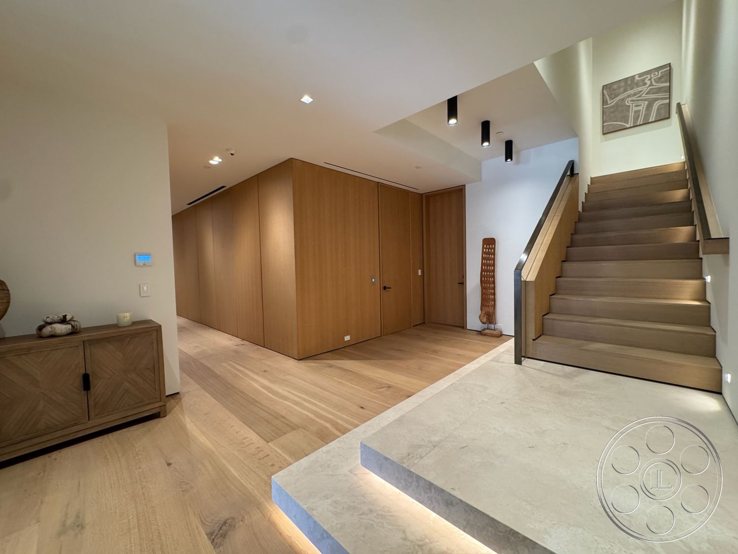 Chalon Estate - natural light, hardwood flooring, textured wall art, modern design, recessed ceiling lights, wood panel accent wall, open floor concept, concrete entry steps, floating wood staircase