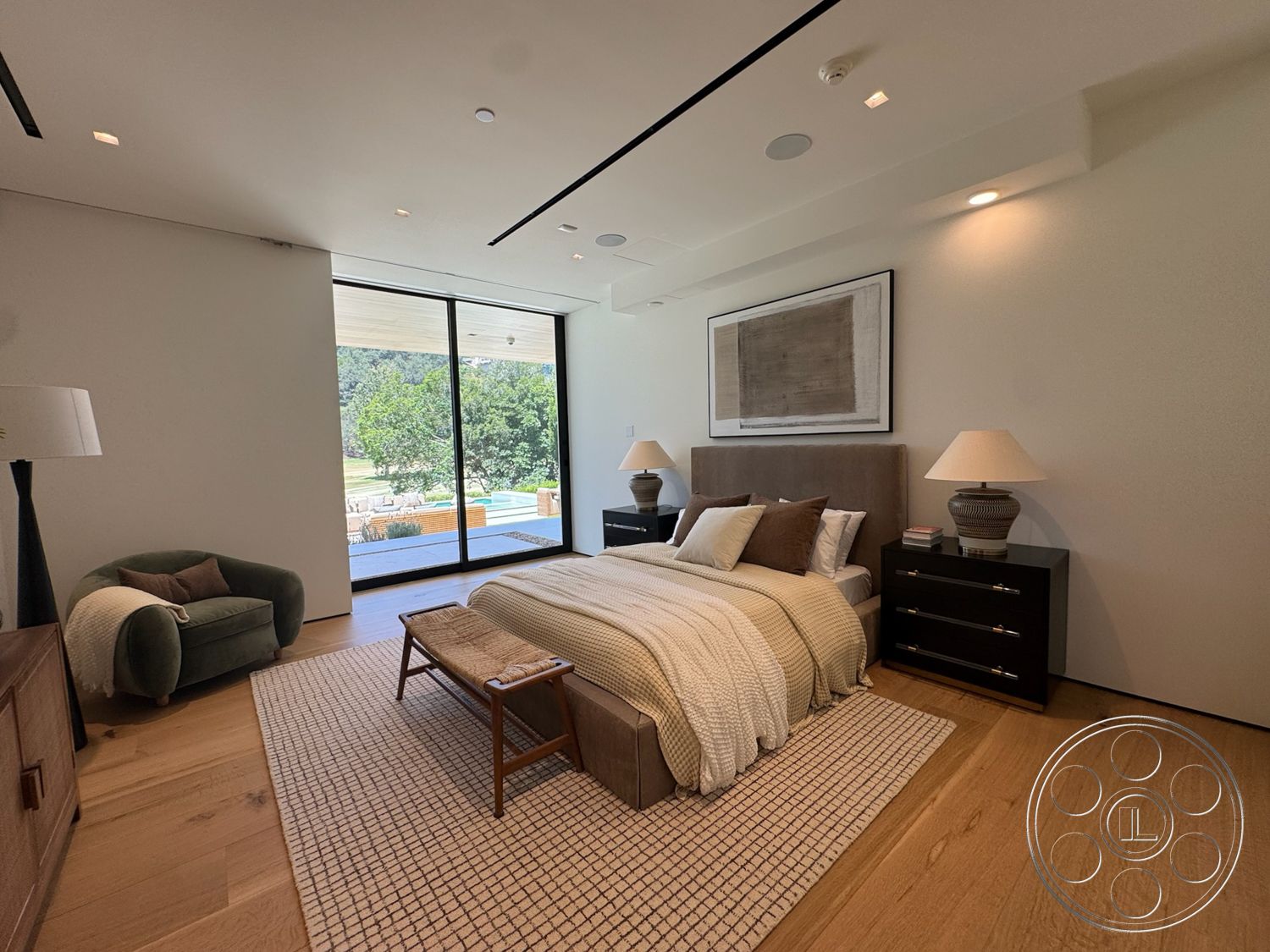 Chalon Estate - neutral color palette, area rug, floor-to-ceiling windows, textured wall treatment, outdoor pool view, accent chair, hardwood bedroom floors, minimalist architectural style, modern bedside tables, king-size bedding, contemporary table lamps