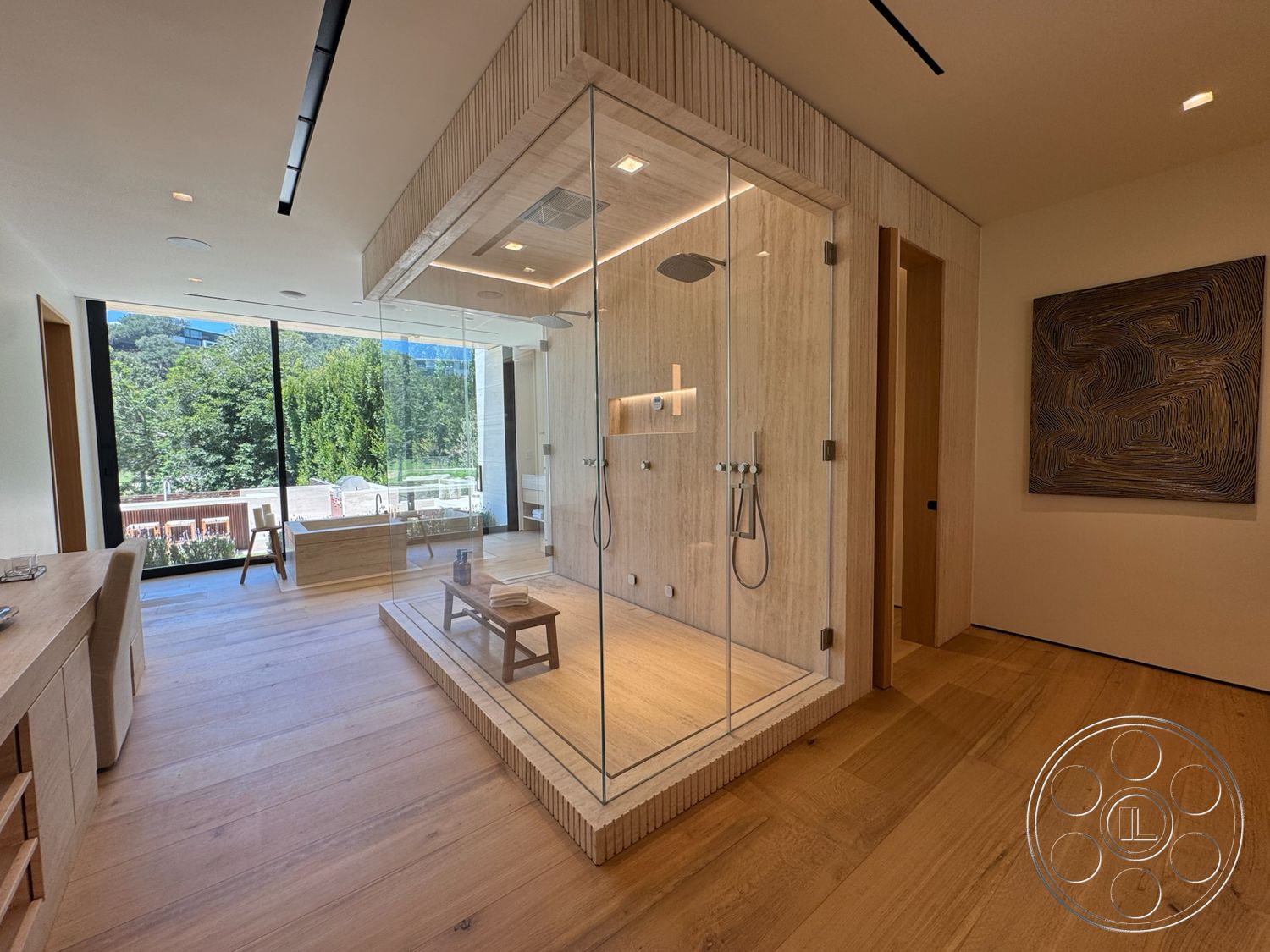 Chalon Estate - natural light, minimalist design, glass shower enclosure, spa-like atmosphere, floor-to-ceiling windows, wood accent wall, contemporary bathroom, open-plan layout, recessed ceiling lighting, textured wood paneling, hardwood bathroom flooring, modern finishings