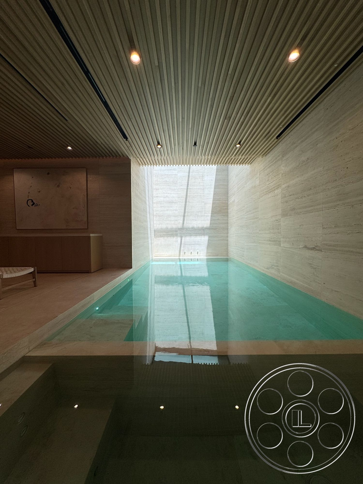 Chalon Estate - recessed ceiling lights, concrete pool border, glass window wall, wood slat ceiling, lightwood cabinetry, marble pool flooring