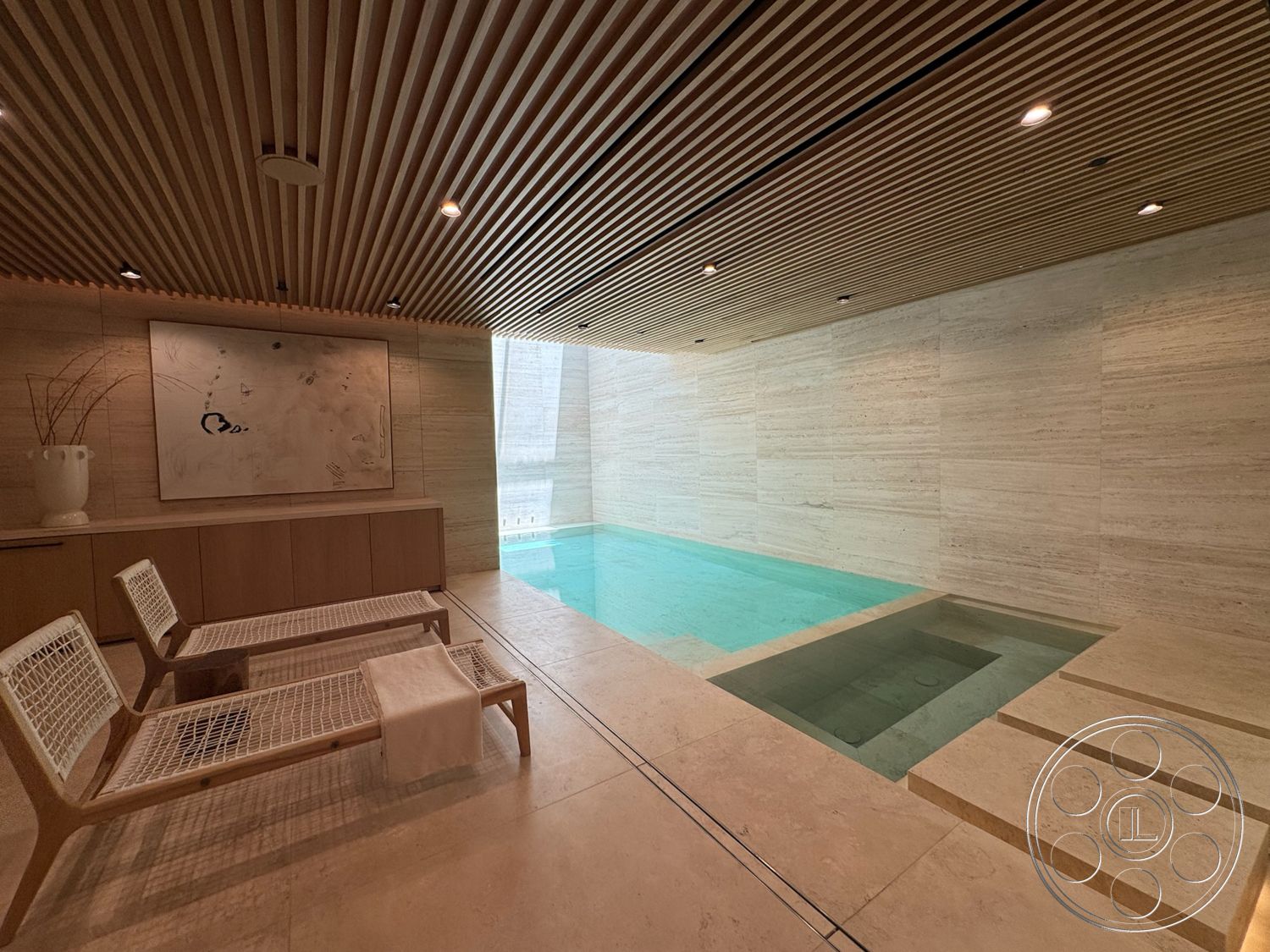 Chalon Estate - minimalist decor, tile flooring, spa room, natural stone walls, wooden lounge chairs, large window with natural light, built-in wooden cabinetry, horizontal wooden ceiling slats, rectangle indoor pool