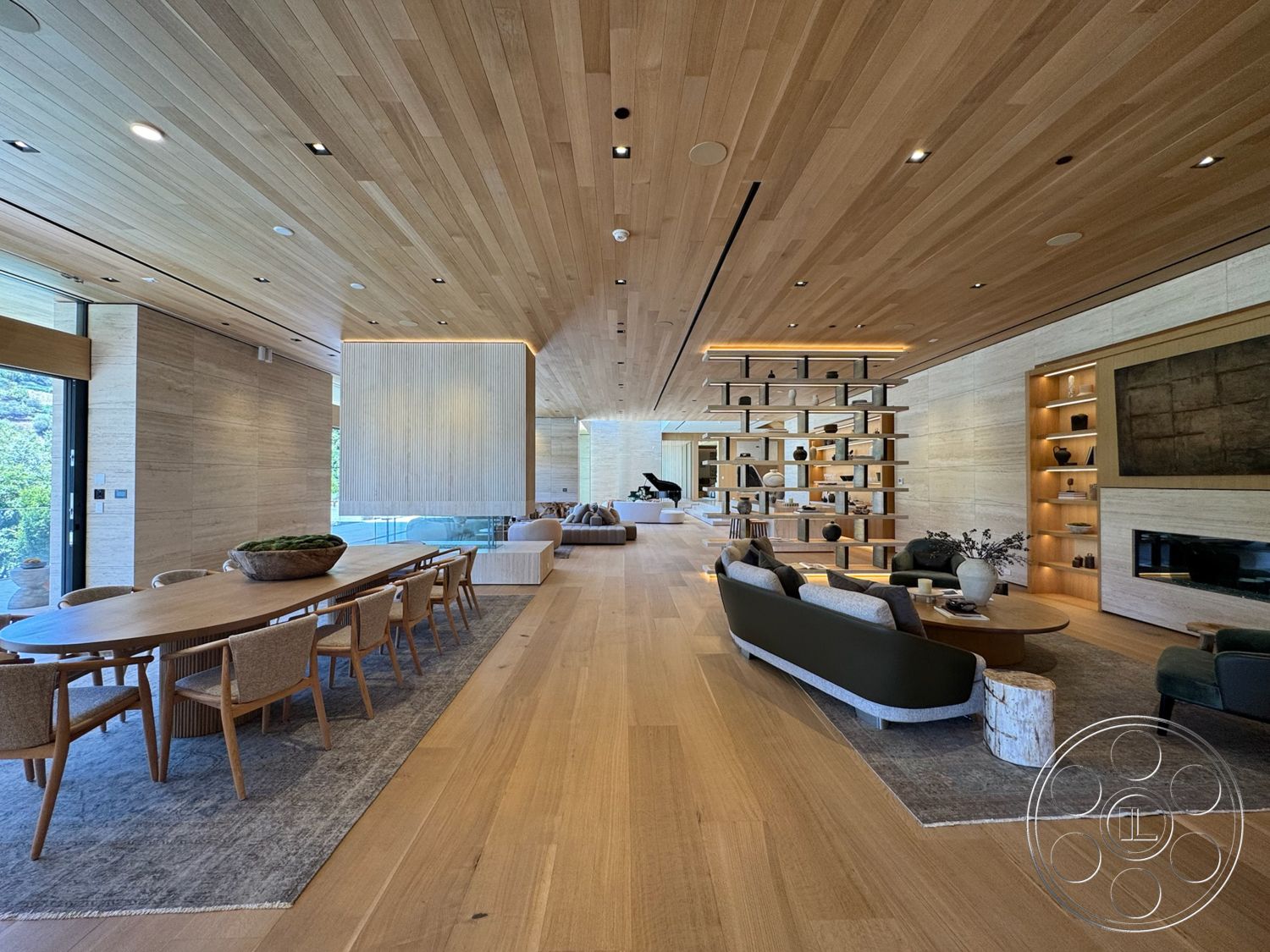 Chalon Estate - minimalist decor, neutral color palette, hardwood flooring, textured stone wall, contemporary furniture, open floor plan, upholstered dining chairs, exposed wood beams, large floor-to-ceiling windows, rectangular dining table, light wood paneling, built-in shelving unit, wood ceiling planks