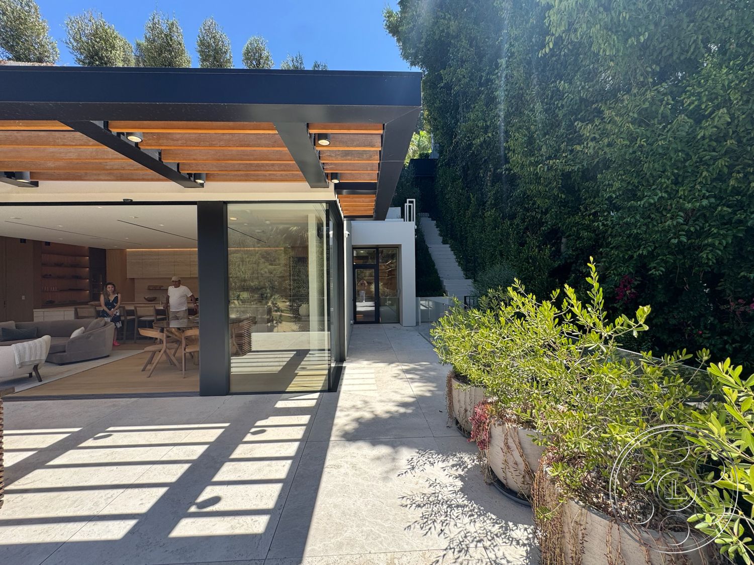 Chalon Estate - natural light, exterior, landscaped garden, open floor plan, urban setting, floor-to-ceiling windows, outdoor dining area, decorative planters, modern architectural style, glass wall, floating staircase, concrete patio flooring, built-in seating area, wood beam details