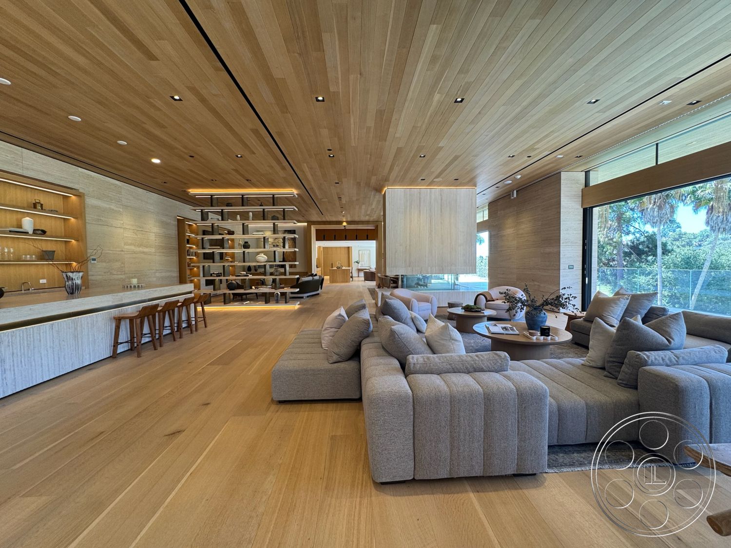 Chalon Estate - neutral color palette, natural light, hardwood flooring, recessed lighting, minimalist design, contemporary decor, floor-to-ceiling windows, open living space, light wood ceiling, suspended light fixtures, exposed wood ceiling beams, modern sectional sofa, built-in shelving unit, stone kitchen countertop