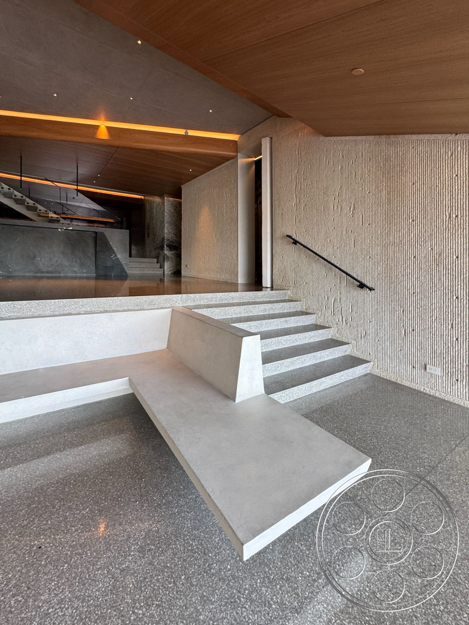 Modern 516 - terrazzo flooring, open concept layout, ambient lighting, concrete bench, modern minimalist design, textured plaster wall, exposed wood ceiling, concrete staircase