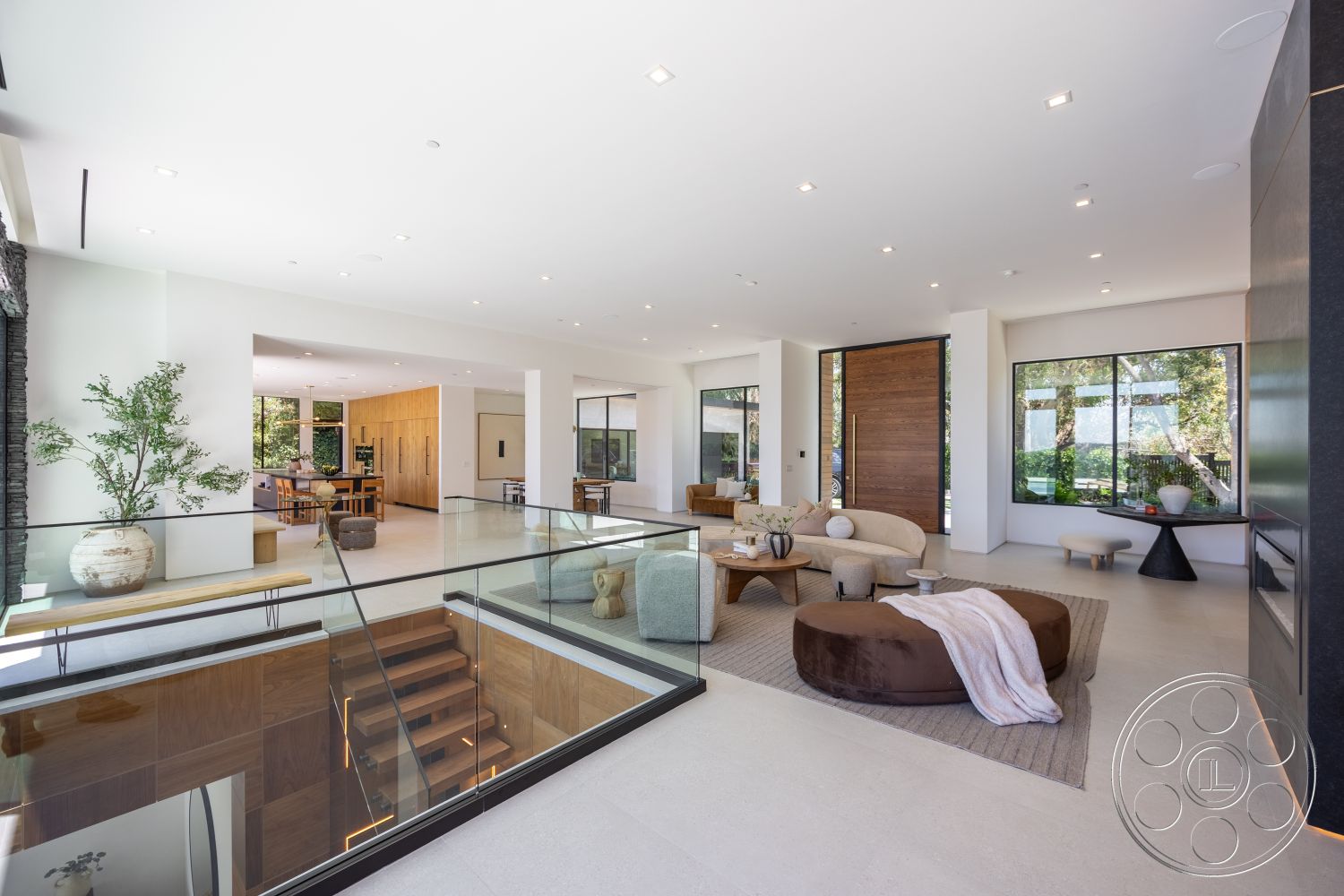 Canyon House - neutral color palette, exterior, modern furniture, concrete flooring, glass railing, outdoor greenery, minimalistic design, decorative planters, open concept living space, large floor-to-ceiling windows, natural light emphasis, textured fabric accents, shiplap wall treatment, vaulted ceilings, wood staircase with built-in lighting, wood accents on cabinetry, landscape visibility
