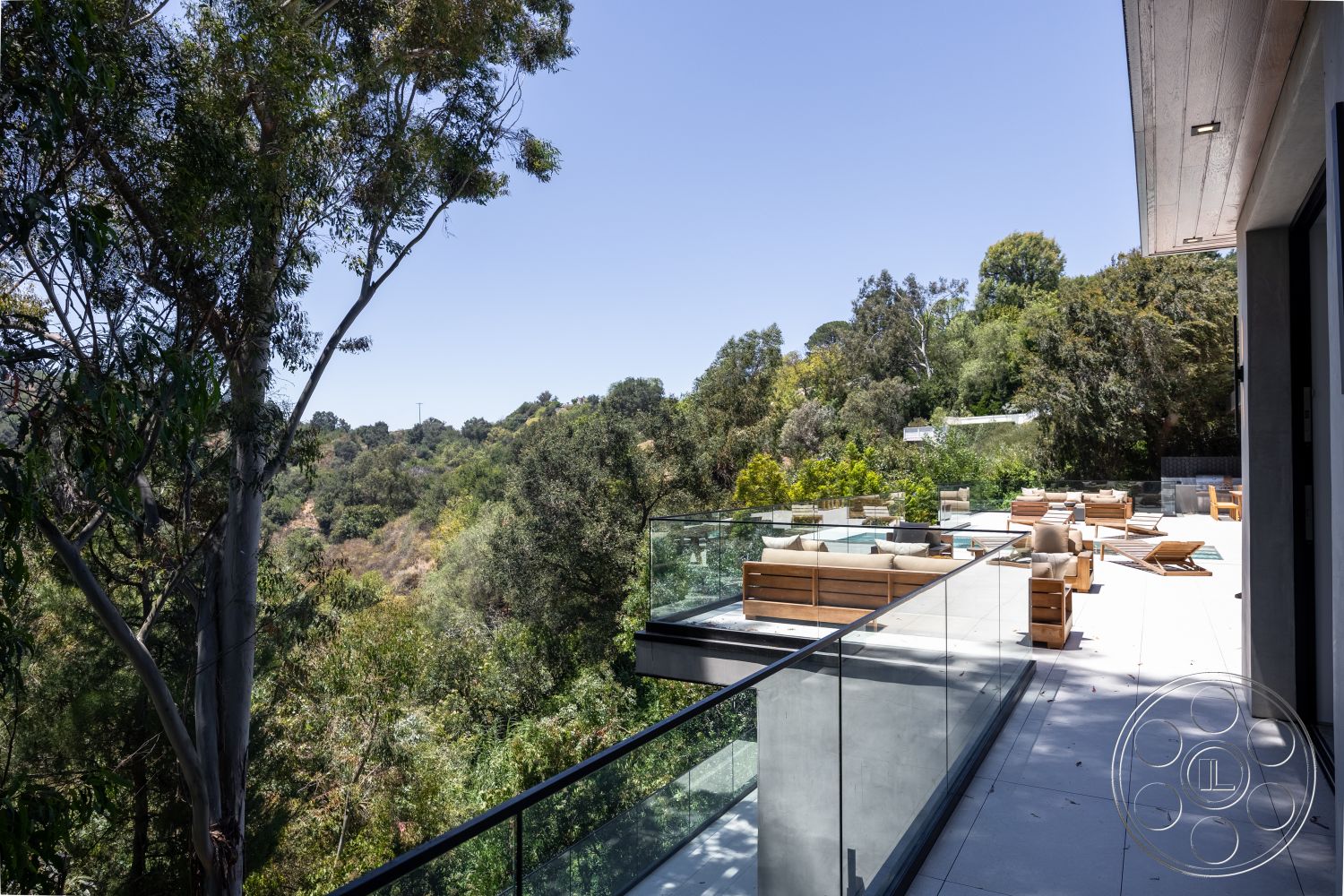 Canyon House - exterior, landscaped surroundings, surrounding trees, modern architectural style, open outdoor space, natural setting, hillside location, wooden outdoor furniture, concrete patio flooring, glass balcony railing