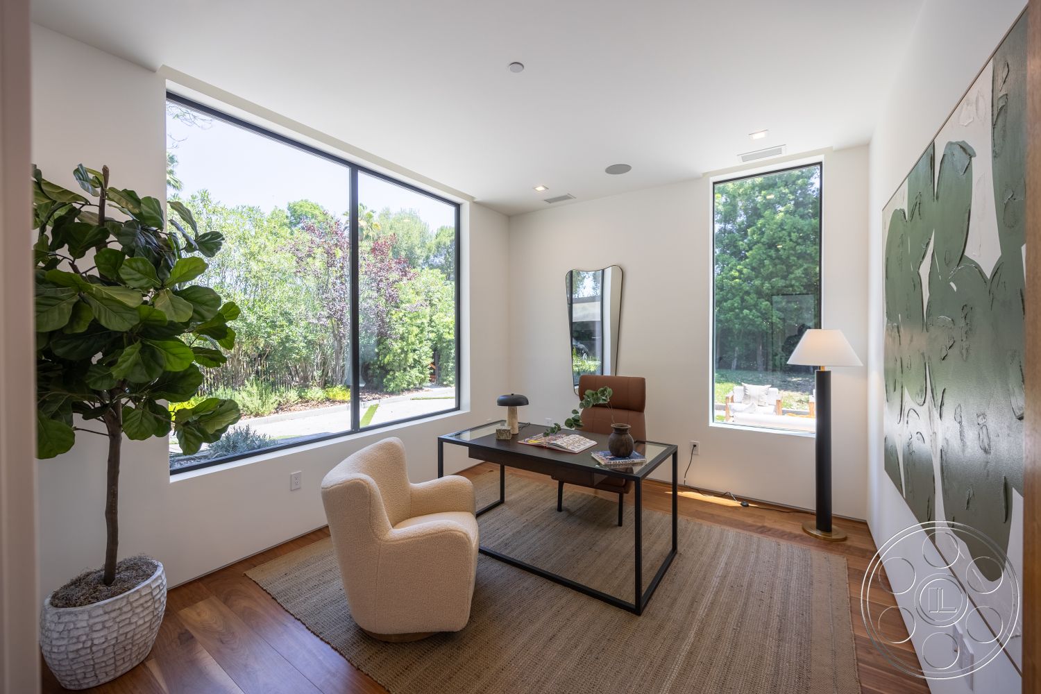 Canyon House - minimalist decor, neutral color palette, natural light, hardwood flooring, indoor plant, floor lamp, framed wall art, upholstered armchair, modern desk, contemporary office space, glass window walls