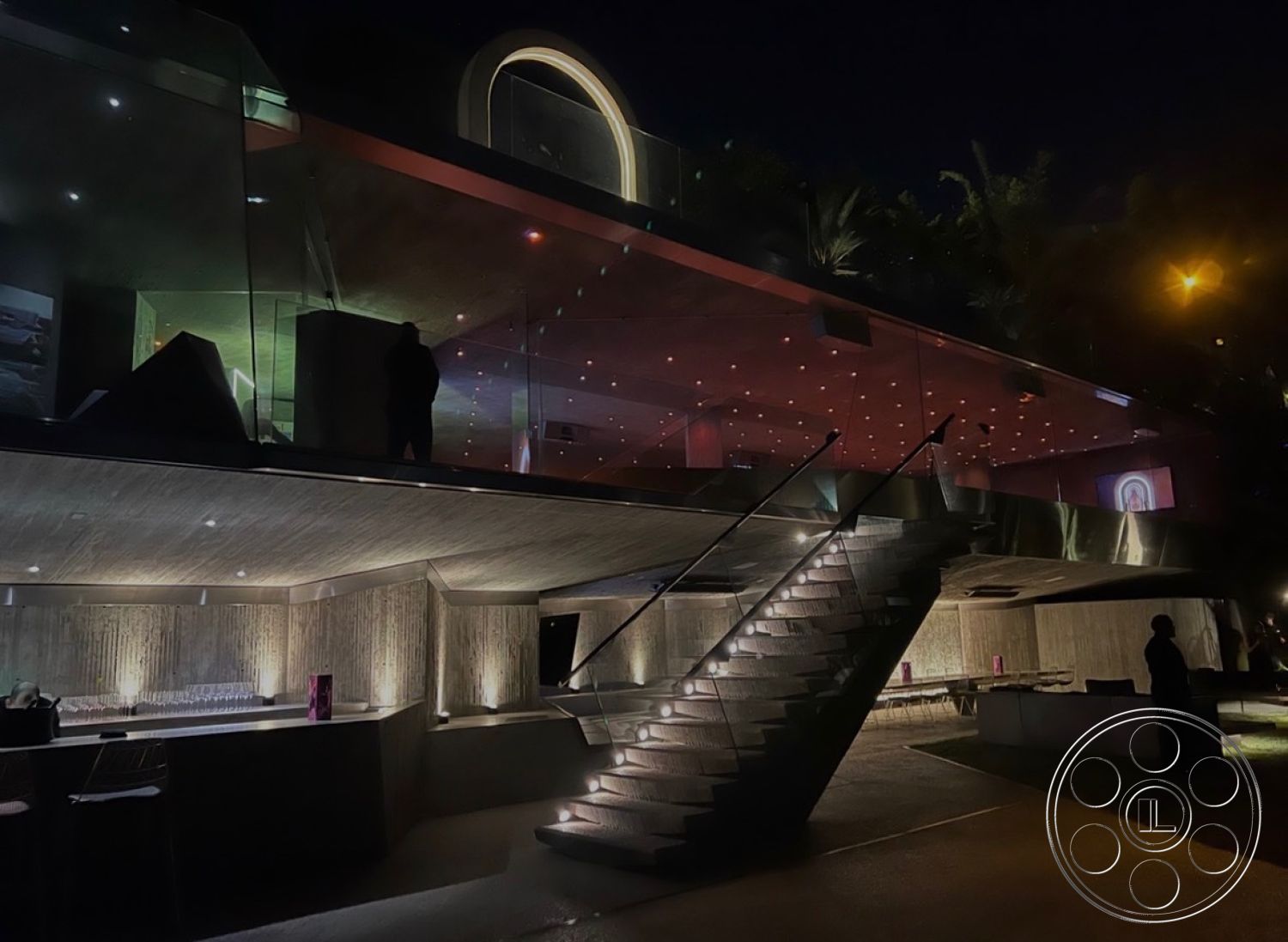 Goldstein House - exterior, open layout, glass railing, concrete walls, floor-to-ceiling windows, concrete steps, modern architectural style, exposed concrete ceiling, landscaped garden setting, stainless steel handrail, night lighting features, smooth concrete patio flooring, LED accent lighting, geometric staircase design