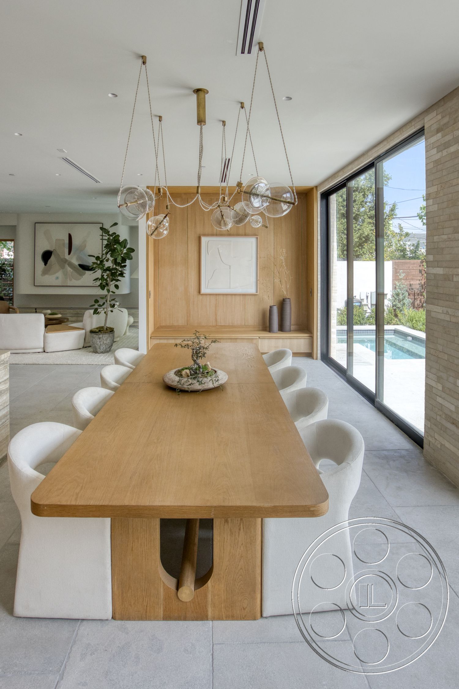 Modern 526 - large windows, polished concrete flooring, open concept layout, upholstered dining chairs, glass sliding doors, contemporary design elements, oak dining table, indoor plant decor, pendant lighting fixtures, minimalist wall art, exposed wood paneling, natural light-filled dining area