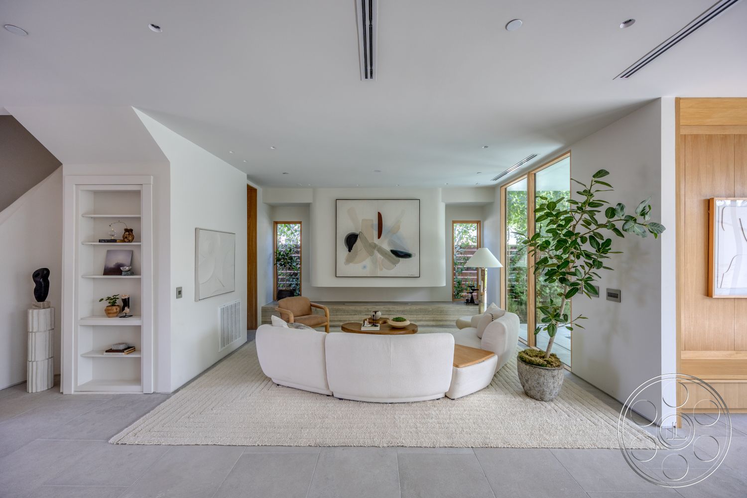Modern 526 - natural light, minimalist design, textured area rug, wooden coffee table, open floor plan, floating shelves, concrete flooring, floor-to-ceiling windows, wood accent wall, bright and airy atmosphere, curved sofa, white painted walls, potted indoor plant, large abstract wall art, modern reading lamp