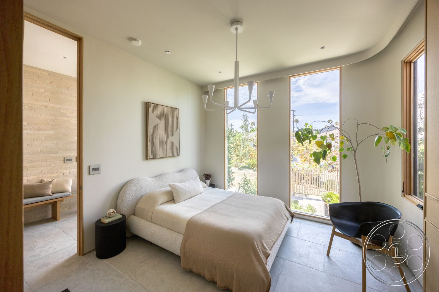 Modern 526 - floor-to-ceiling windows, decorative wall art, light beige bedding, curved wall design, small side table, modern armchair, indoor plant decor, contemporary chandelier lighting, natural wood door frames, wood accent bench, minimalist bed design, slate tile bedroom flooring, cloud-like upholstered bed frame, light-colored textured wall