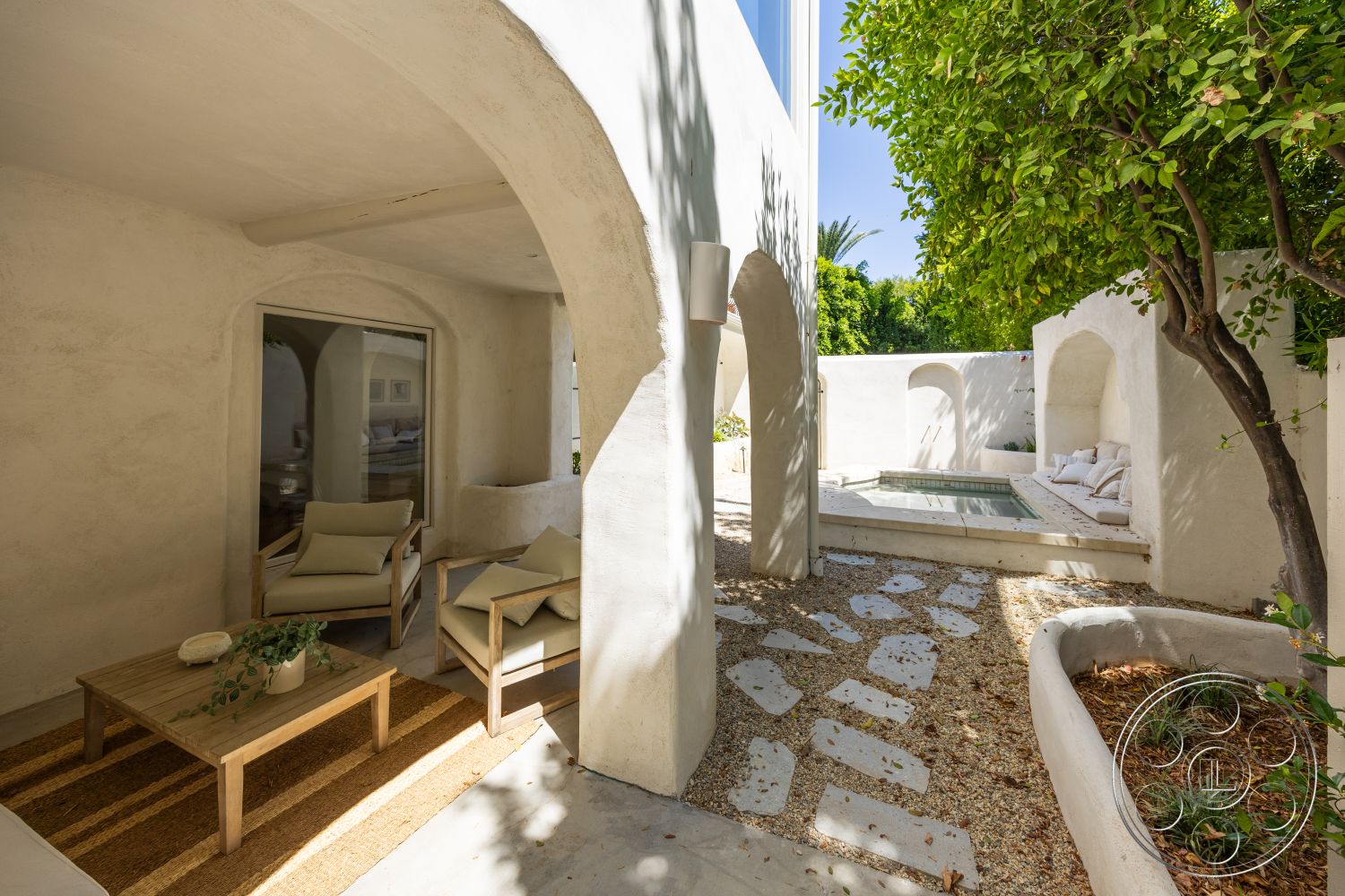 Medit 168 - wood coffee table, minimalist design elements, outdoor furniture, stucco walls, arched doorways, textured plaster walls, natural stone pathway, landscaped garden area, concrete patio floor, sunlit outdoor space, tile pool surround, sectional outdoor seating
