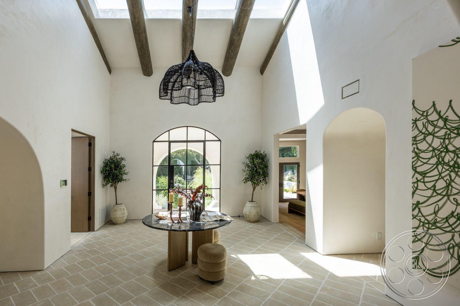Medit 168 - open concept layout, modern pendant lighting, floor-to-ceiling windows, natural stone flooring, arched doorways, textured plaster walls, exposed wood ceiling beams, interior entrance hall