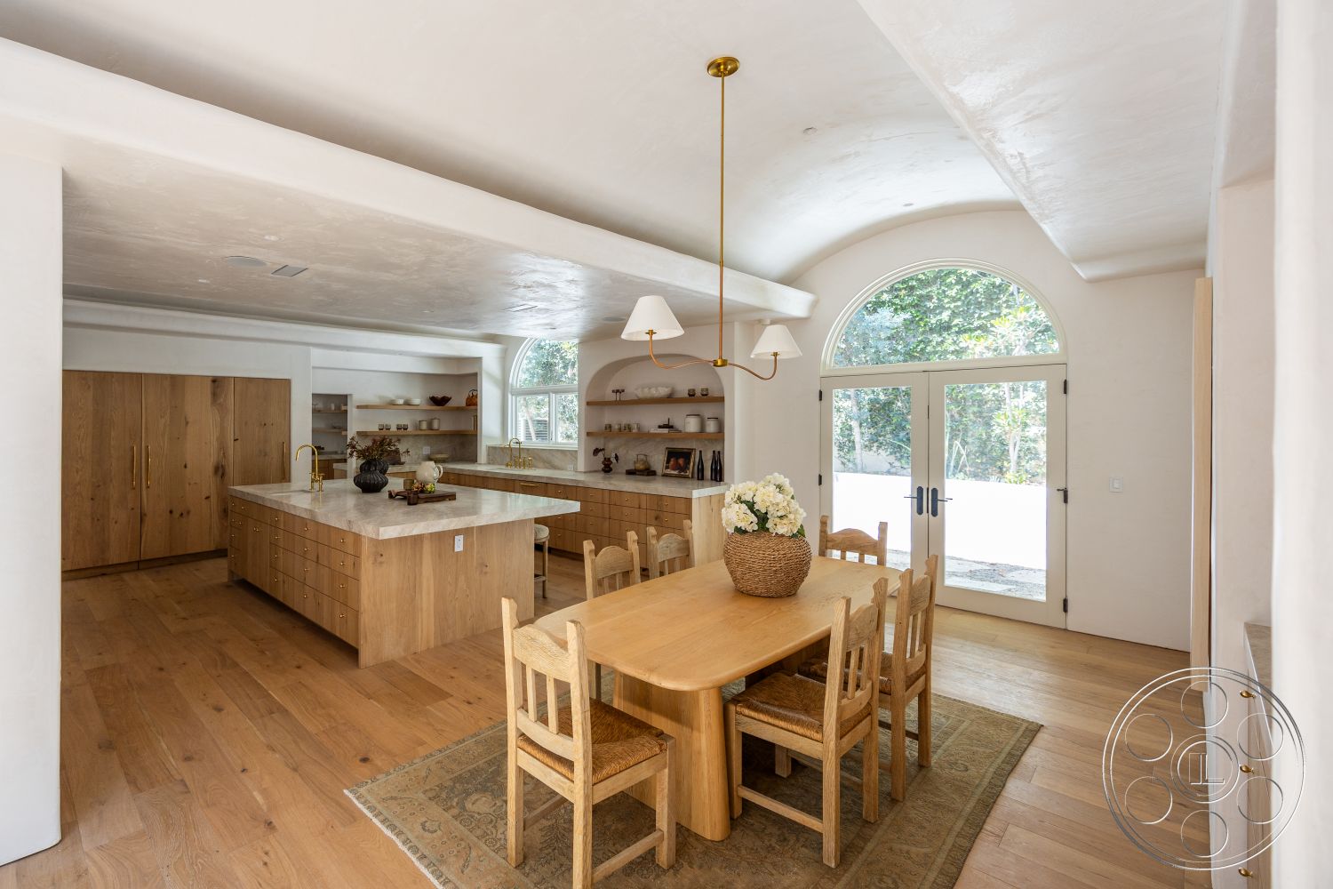 Medit 168 - neutral color palette, natural light, arched windows, woven dining chairs, laminate wood flooring, modern home design, recessed lighting fixtures, gold hardware accents, built-in shelving units, quartz kitchen countertops, open floor plan kitchen, solid wood dining table, plaster ceiling finish, oak kitchen cabinetry