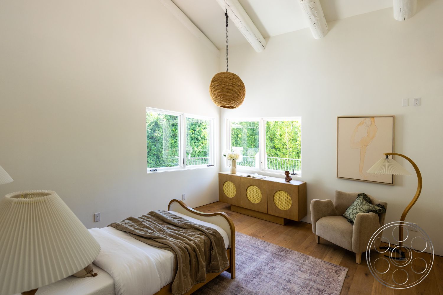 Medit 168 - neutral color palette, large windows, textured area rug, contemporary furniture, woven pendant light, cozy reading nook, mid-century modern style, hardwood bedroom floors, wood beam ceiling, white painted walls, modern accent chair, built-in storage unit, decorative side table