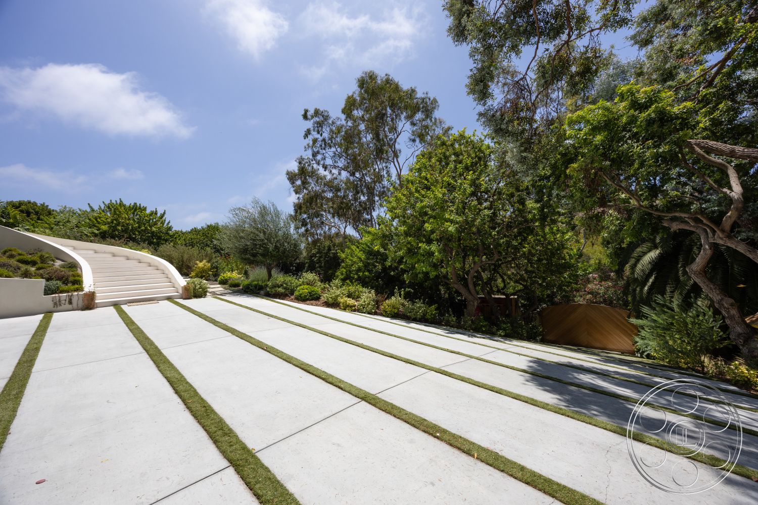 Americana 434 - exterior, lush greenery, minimalist style, concrete driveway, outdoor setting, landscaped garden beds, modern architectural design, curved concrete steps, natural grass strips, tree-lined pathway