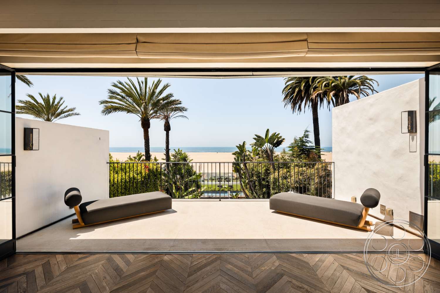 Beach 137 - white stucco walls, minimalist design elements, floor-to-ceiling windows, beachfront view, modern lounge chairs, concrete patio flooring, palm tree landscaping, herringbone hardwood flooring, outdoor deck view