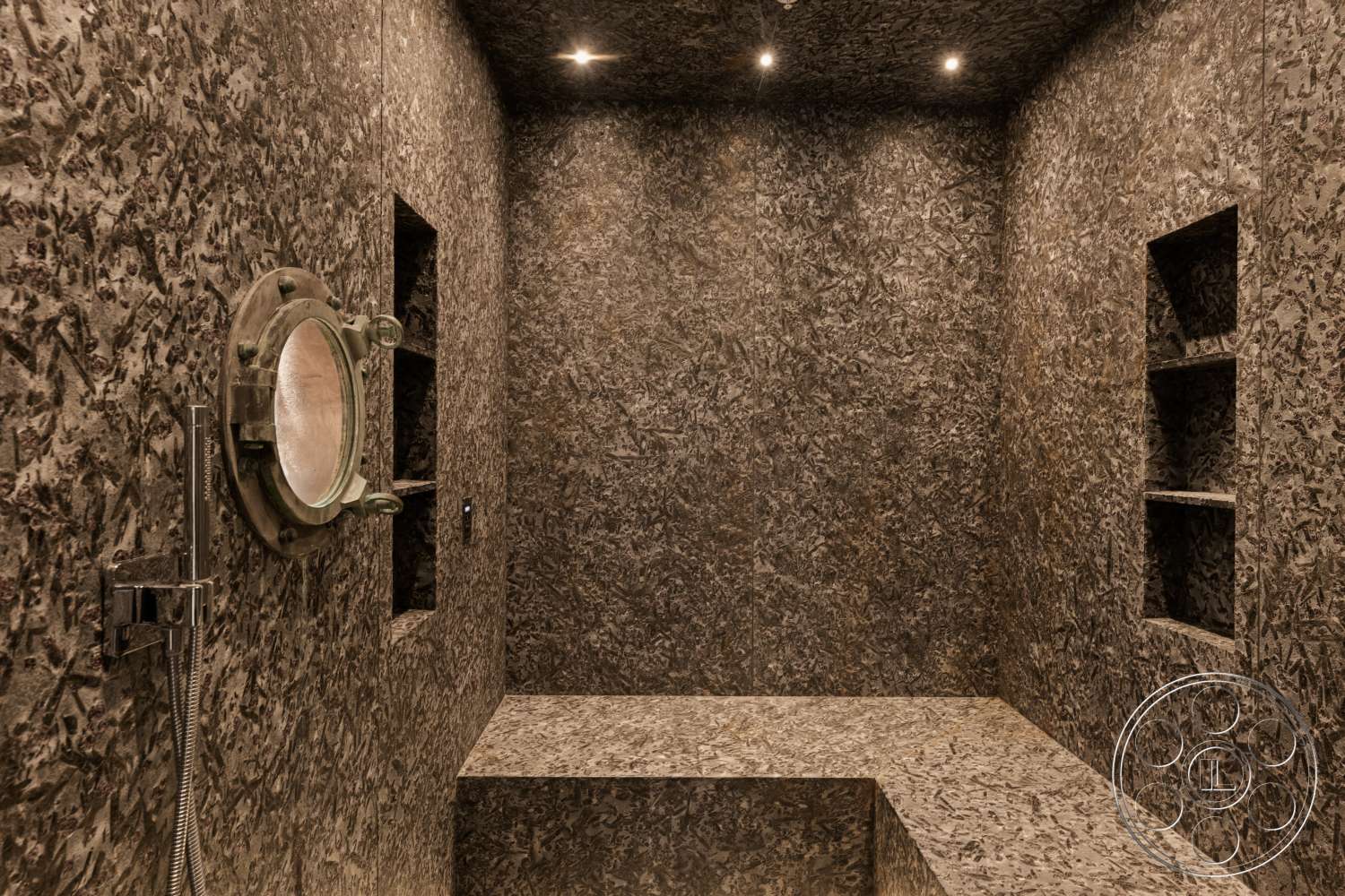 Beach 137 - textured plaster walls, recessed ceiling lights, dark stone bench, built-in niche shelves, circular porthole mirror