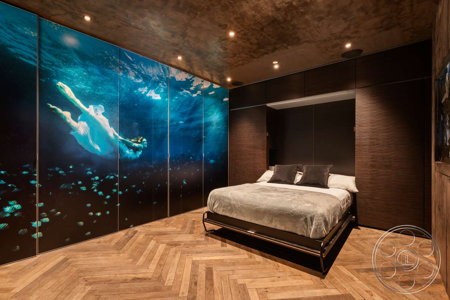 Beach 137 - recessed lighting, plush bedding, textured ceiling, herringbone wood flooring, built-in wardrobe, floor-to-ceiling storage cabinets, minimalist bed frame, dark wood paneling wall treatment, large underwater mural wall decor