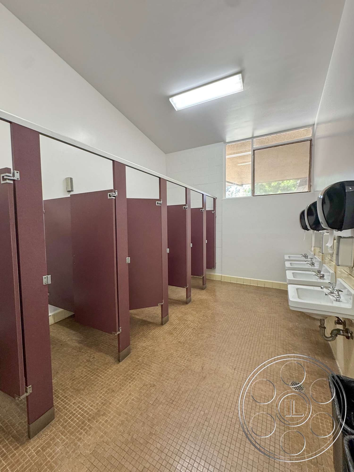 School 20 - stainless steel sink, window with blinds, white painted walls, interior restroom, vinyl tile flooring, fluorescent ceiling lighting, maroon partition walls, mosaic tile floor, dual-handle faucets, hand dryer, wastebasket