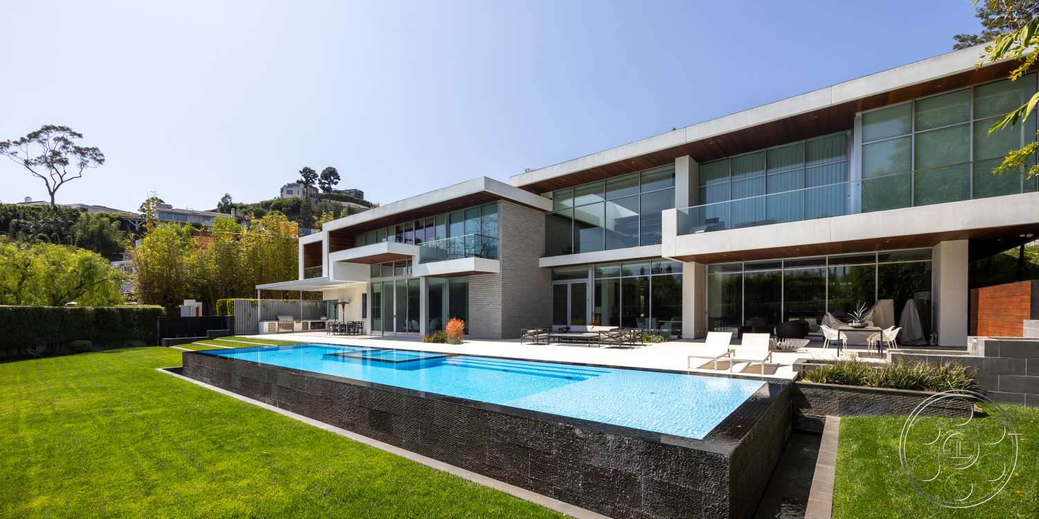 Modern 14 - exterior, landscaped garden, outdoor seating area, floor-to-ceiling windows, grass lawn, modern architectural style, rectangular pool, stone patio flooring, concrete pool border, glass exterior walls, brick feature wall, wood deck area, wood ceiling details