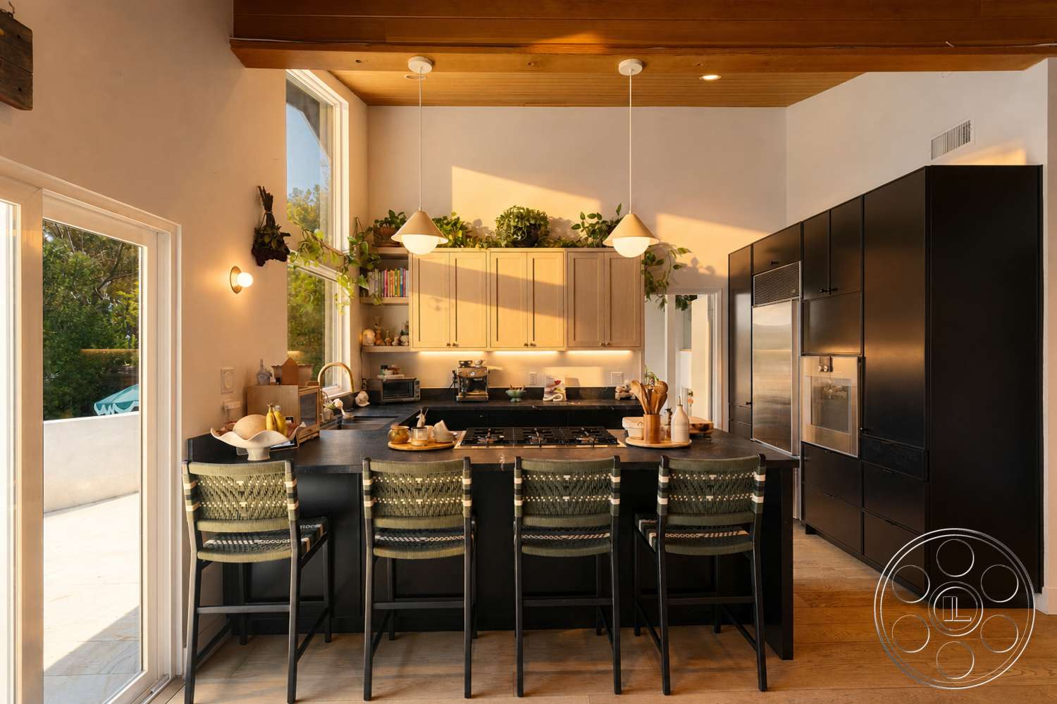 Americana 435 - high ceilings, open floor plan, light wood flooring, stainless steel appliances, floor-to-ceiling windows, black granite countertop, pendant lighting fixtures, minimalist kitchen design, wood beam ceiling, vegetation accents, dark wood kitchen cabinets, neutral paint walls, breakfast bar seating