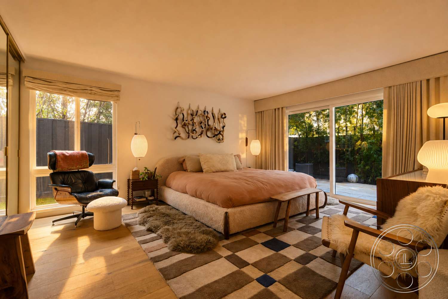 Americana 435 - minimalist decor, textured wall art, hanging pendant light, floor-to-ceiling windows, sliding glass door, wooden bed frame, plush area rug, light-colored curtains, outdoor patio view, hardwood bedroom floors, beige painted walls, contemporary table lamp, modern accent chair