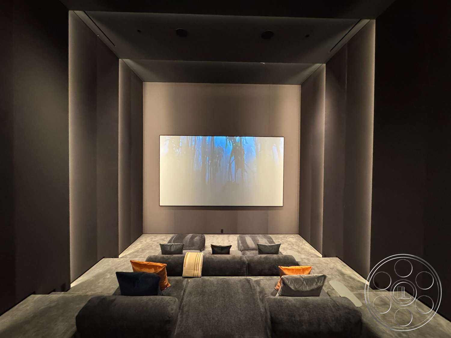 The Bellagio Estate - recessed lighting, modern design elements, media room, textured carpet flooring, soft seating area, dark fabric wall panels, screened projection wall