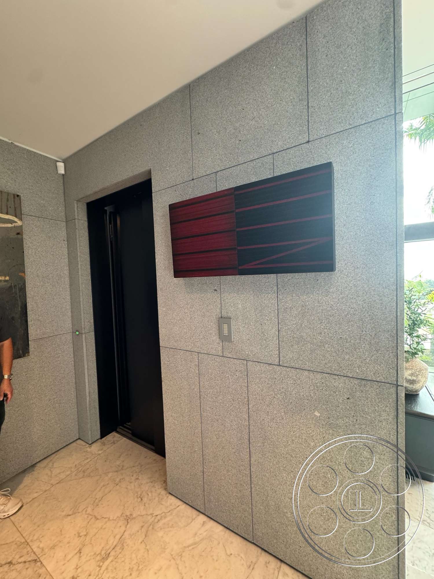 The Bellagio Estate - contemporary design elements, wood accent wall, modern architectural details, interior marble flooring, exterior wall cladding granite panels, black elevator door