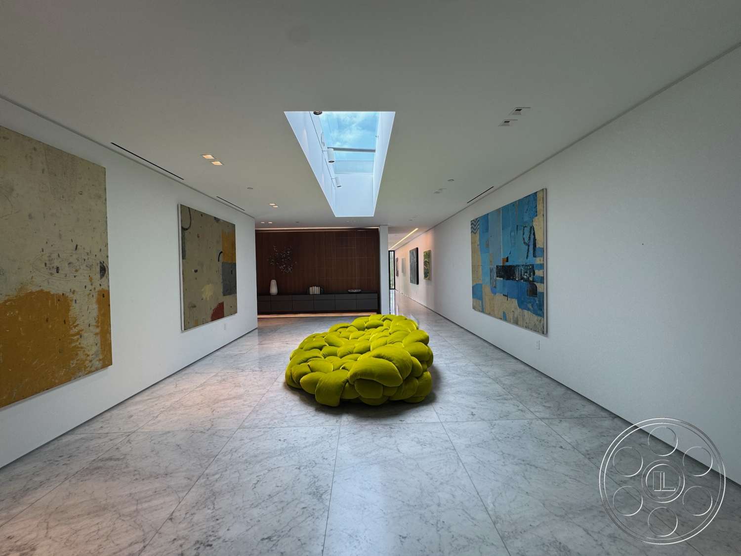 The Bellagio Estate - large windows, contemporary furniture, marble flooring, skylight, built-in cabinetry, minimalistic aesthetic, white painted walls, open layout design, modern art wall paintings