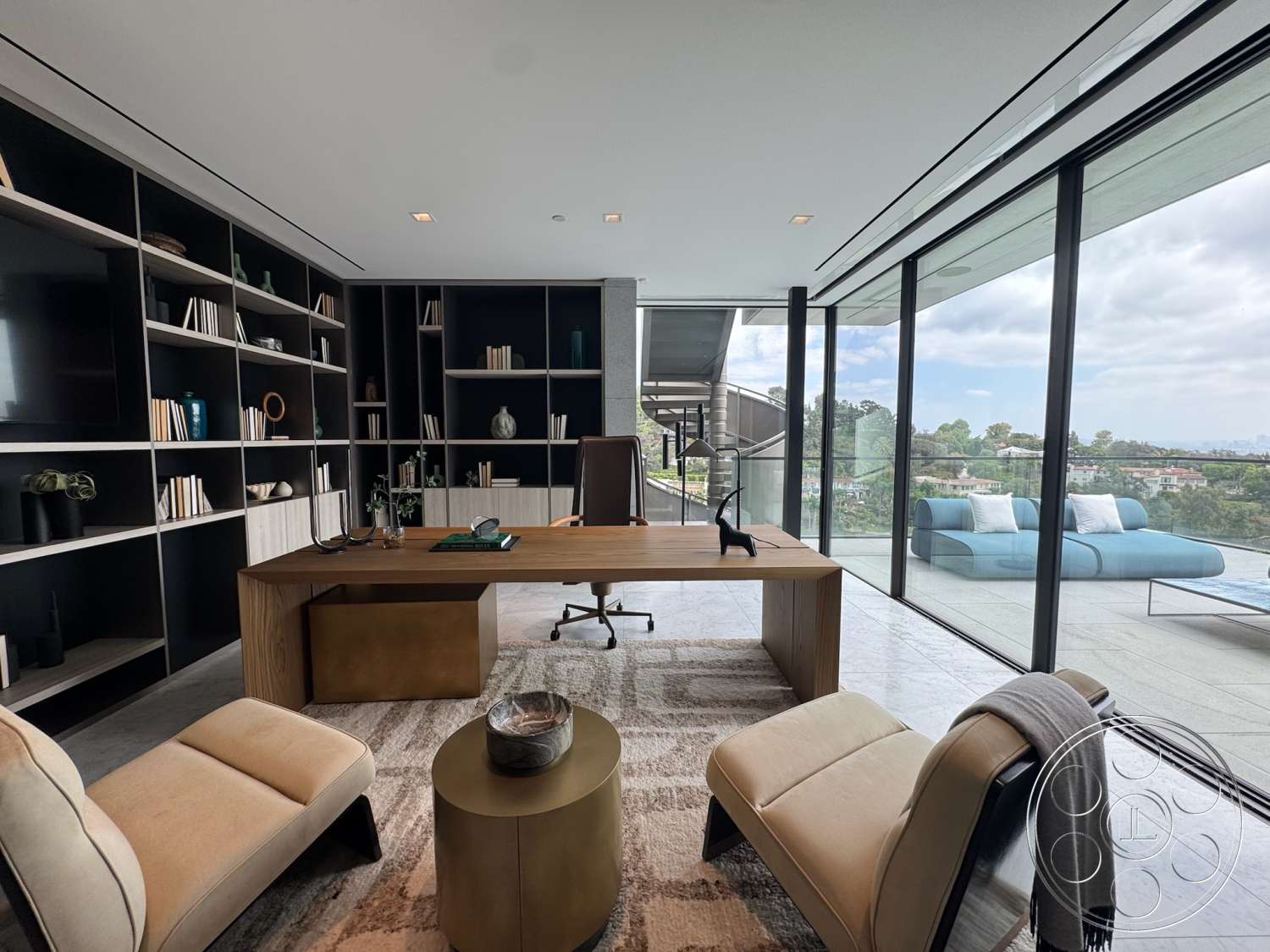 The Bellagio Estate - natural light, minimalist design, concrete flooring, sliding glass doors, wooden desk, modern office, textured wall treatments, floating staircase, glass partition walls, open shelving unit, stone wall accent, view of surrounding landscape