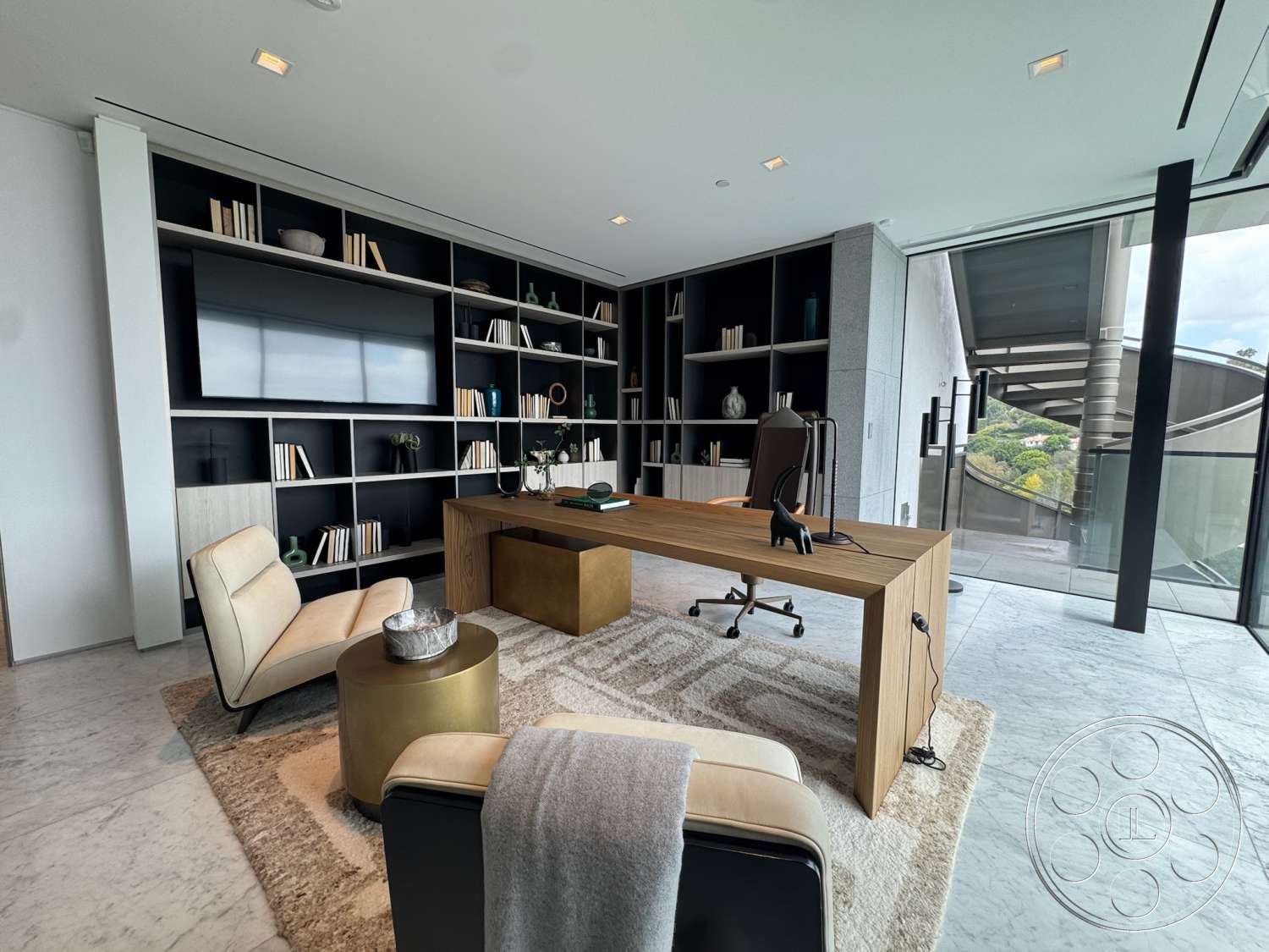 The Bellagio Estate - minimalist decor, natural light, open space layout, large glass windows, greenery view, home office, marble flooring, contemporary office design, textured white walls, round decorative table, wood desk with clean lines, black shelving units, modern ergonomic chair