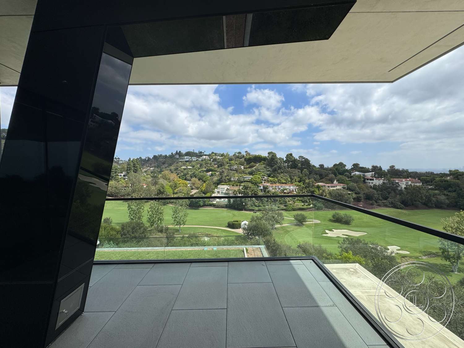 The Bellagio Estate - exterior, minimalist aesthetic, hillside location, contemporary architectural style, modern home design, flat roof structure, glass railing balcony, black concrete floor, rectangular panoramic windows, landscape garden view