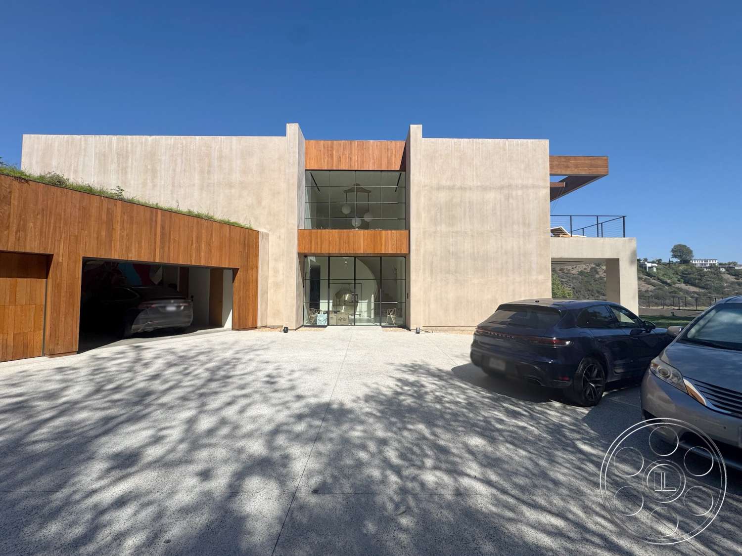 Modern 527 - exterior, floor-to-ceiling windows, outdoor terrace, concrete facade, flat roof design, modern minimalist design, rectangular structure, textured concrete driveway, open garage space, wood accent cladding, angular architectural style, landscaped greenery on roof