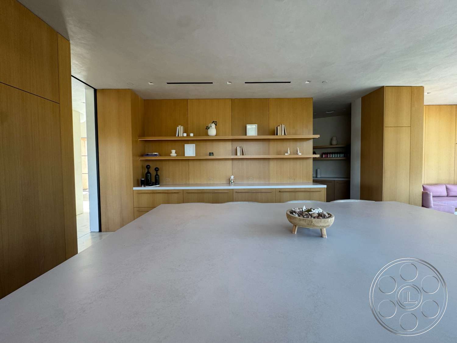 Modern 527 - contemporary style, minimalist design, light wood cabinetry, white stone countertop, open kitchen layout, rectangular kitchen island, natural light through large windows, built-in kitchen cabinets, smooth plaster ceiling, shelf with decorative objects