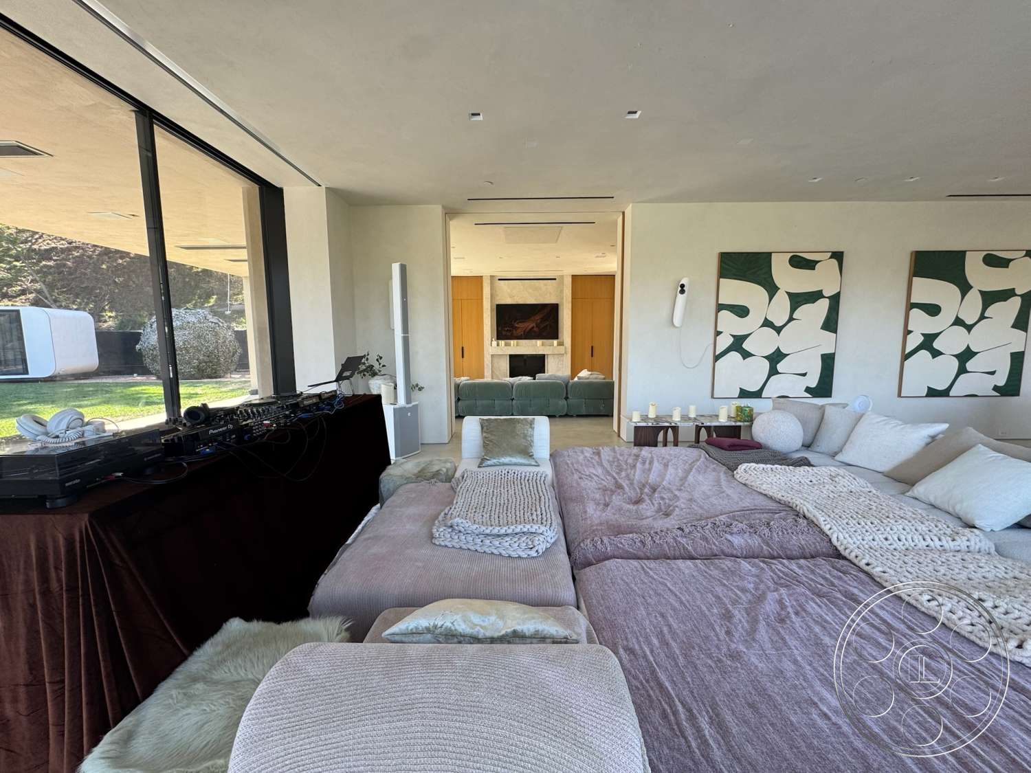 Modern 527 - neutral color palette, textured wall art, exposed concrete walls, floor-to-ceiling windows, decorative throw pillows, open-concept layout, wooden accent wall, minimalist furniture design, plush bedding textiles, soft lighting from candles, elegant bedside tables