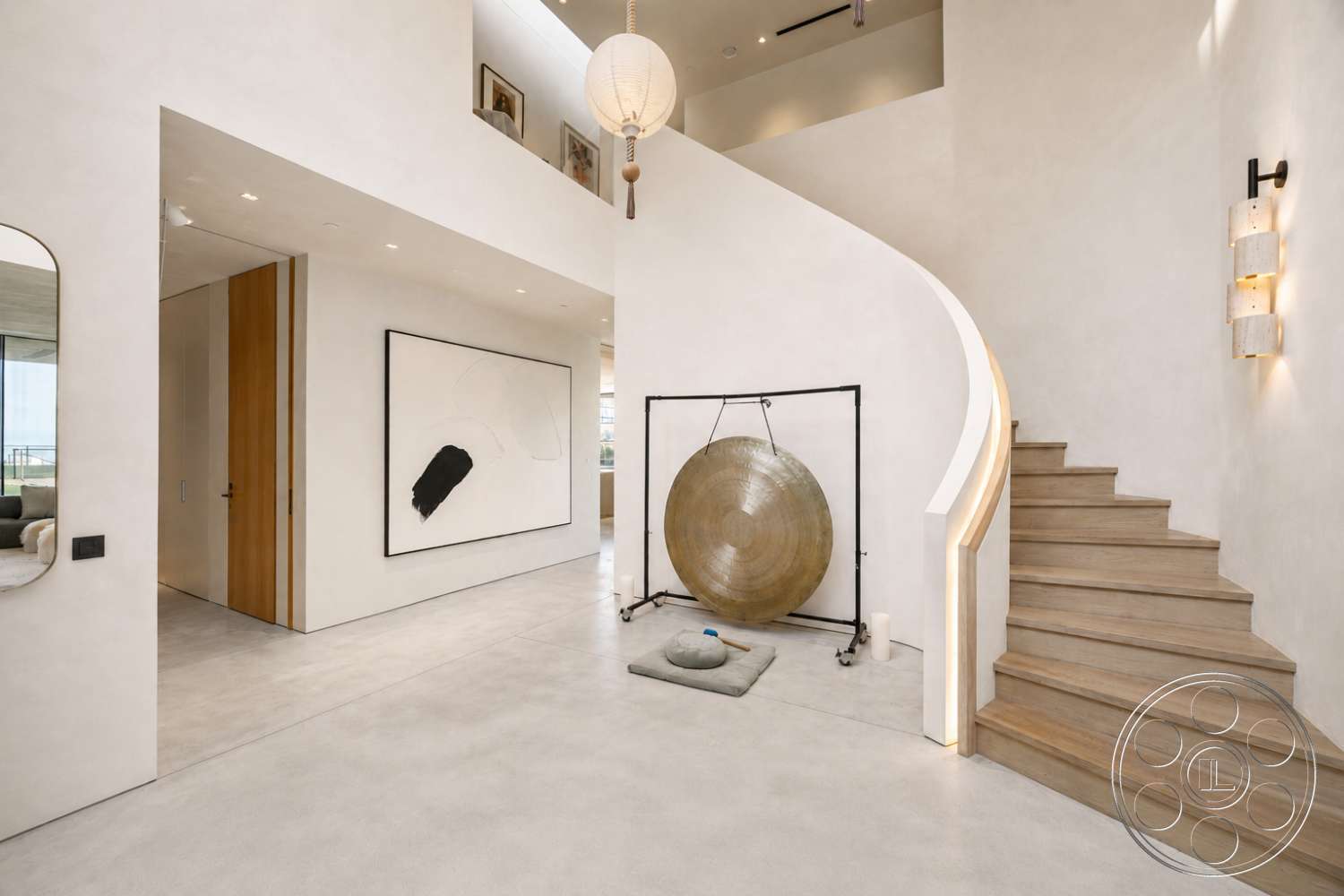 Modern 527 - polished concrete flooring, modern pendant lighting, textured ceiling, wooden stair treads, curved staircase, stucco wall finish, white painted walls, minimalist wall art, accent light fixtures, glass wall elements, built-in wooden wall paneling