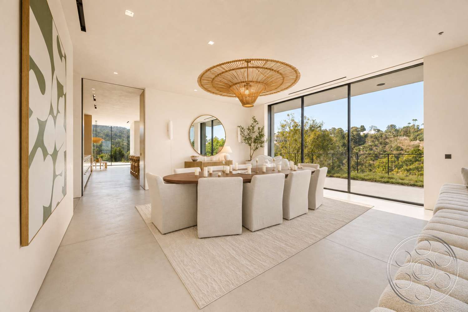 Modern 527 - natural light, contemporary style, modern decor, minimalist design, neutral wall colors, textured area rug, open floor plan, concrete flooring, upholstered dining chairs, greenery view, floor-to-ceiling windows, artwork on wall, round dining table, woven pendant light, large dining area
